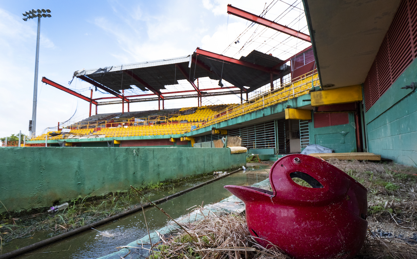 CAROLINA, PUERTO RICO - NOVEMBER 13: A remaining batting helmet sits on the field at the Roberto Clemente Municipal Stadium on November 13, 2018 in Carolina, Puerto Rico. The ballpark was once used for minor league AA baseball. The stadium is set to be demolished due to the extended damage it sustained from Hurricane Maria. The effort continues in Puerto Rico to remain and rebuild more than one year after the Hurricane Maria hit and devastated the island on September 20, 2017. The official number of deaths from the disaster is 2,975. (Photo by Al Bello/Getty Images for Lumix)