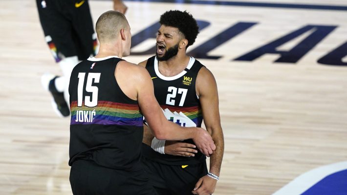 Nikola Jokic and Jamal Murray of the Denver Nuggets celebrate