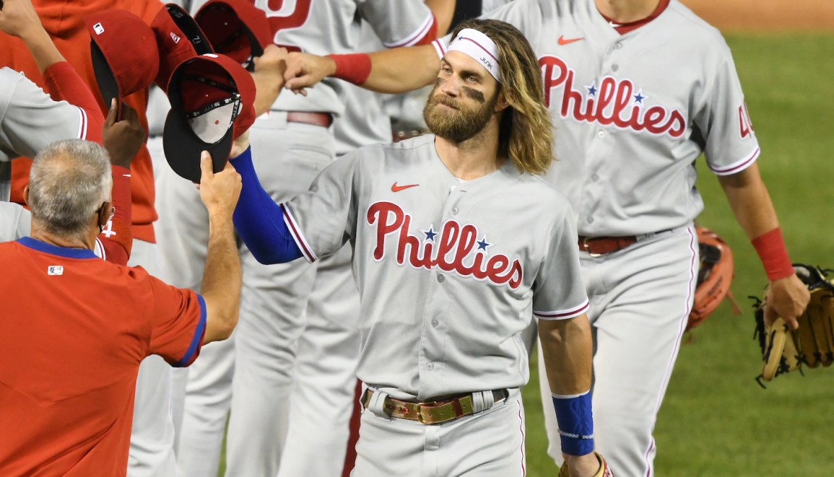 WASHINGTON, DC - AUGUST 25: Bryce Harper #3 of the Philadelphia Phillies celebrates a win with teammates after during a baseball game against the Washington Nationals at Nationals Park on August 25, 2020 in Washington, DC. (Photo by Mitchell Layton/Getty Images)