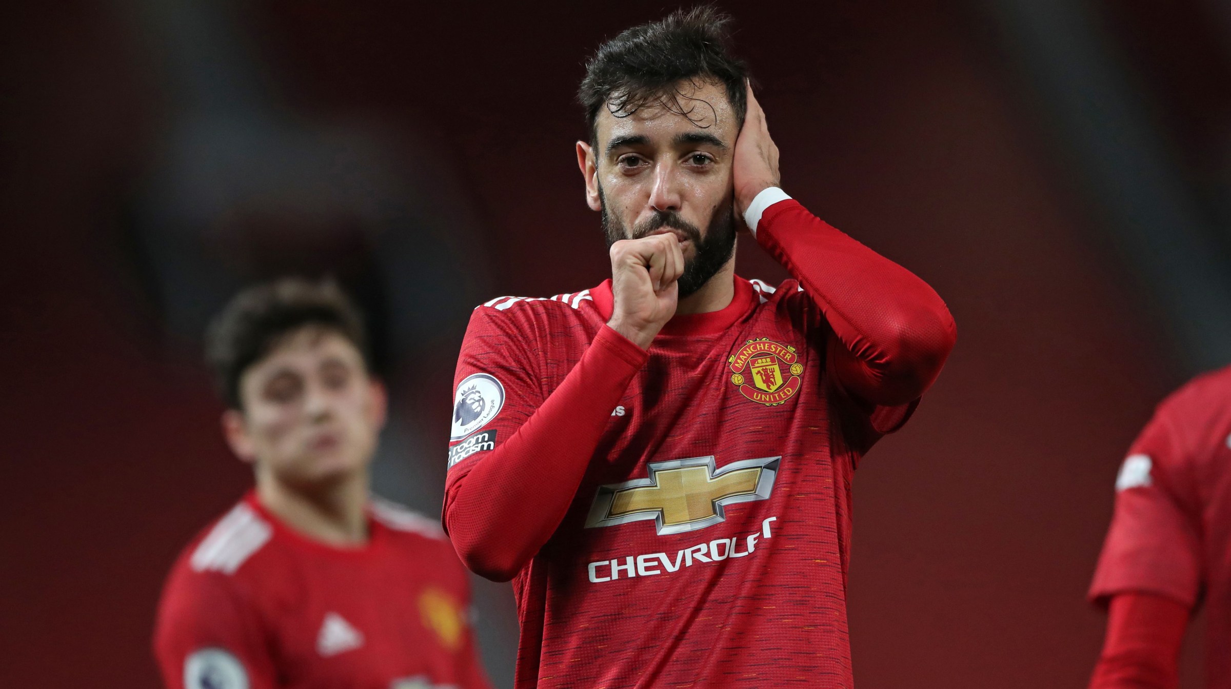 Manchester United's Portuguese midfielder Bruno Fernandes celebrates after scoring their third goal during the English Premier League football match between Manchester United and Leeds United at Old Trafford in Manchester, north west England, on December 20, 2020.