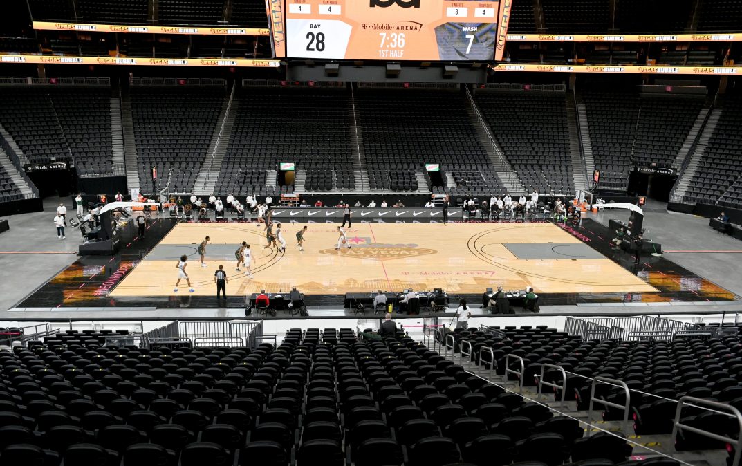 The Washington Huskies and the Baylor Bears play in the first half of their game during the #VegasBubble basketball tournament in an empty T-Mobile Arena