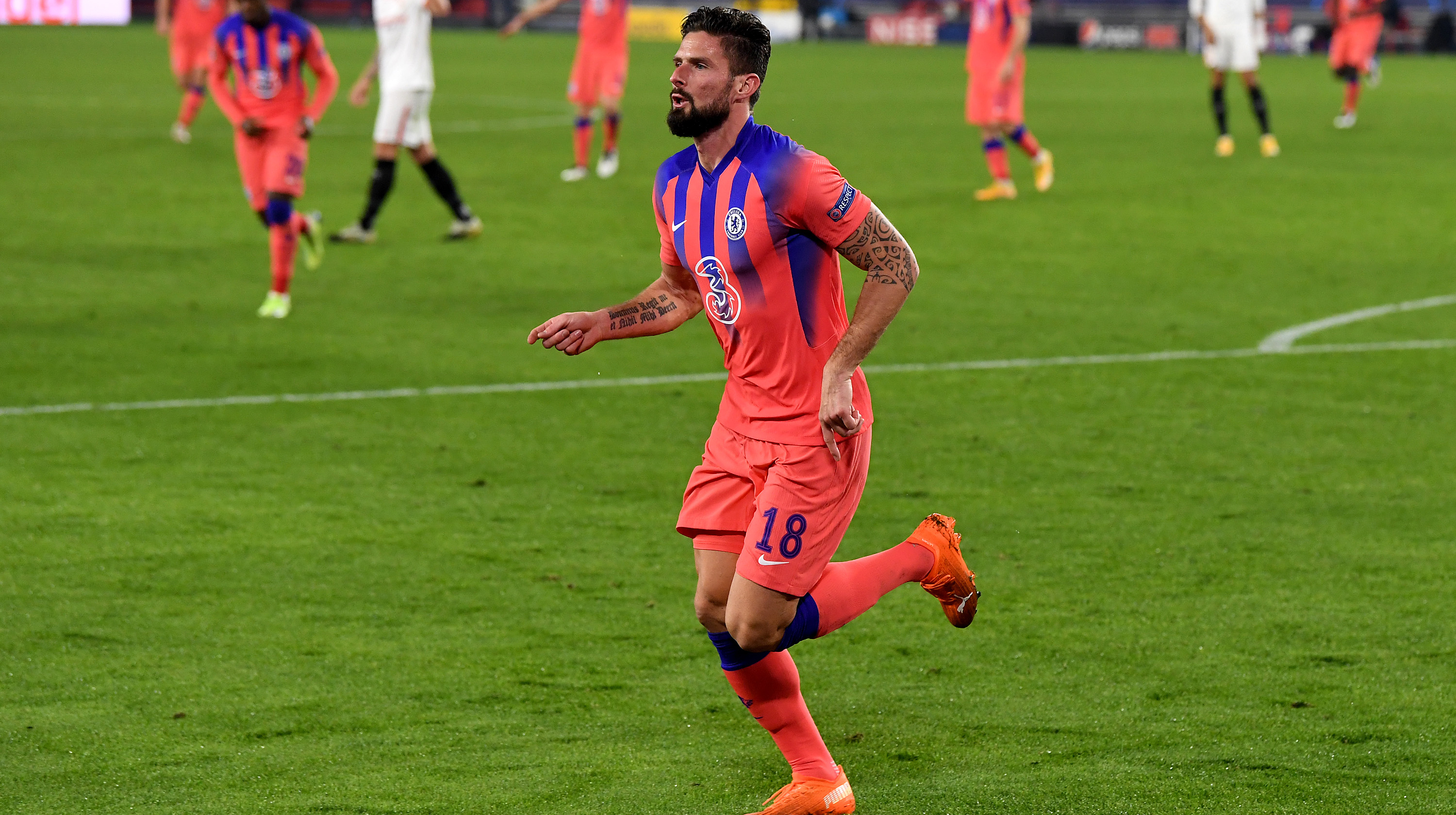 Olivier Giroud of Chelsea celebrates after scoring their sides second goal during the UEFA Champions League Group E stage match between FC Sevilla and Chelsea FC at Estadio Ramon Sanchez Pizjuan on December 02, 2020 in Seville, Spain.