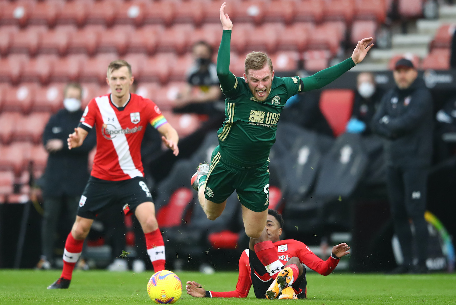 Oliver McBurnie of Sheffield United is fouled by Kyle Walker-Peters of Southampton during the Premier League match between Southampton and Sheffield United at St Mary's Stadium on December 13, 2020 in Southampton, England. A limited number of spectators (2000) are welcomed back to stadiums to watch elite football across England. This was following easing of restrictions on spectators in tiers one and two areas only.