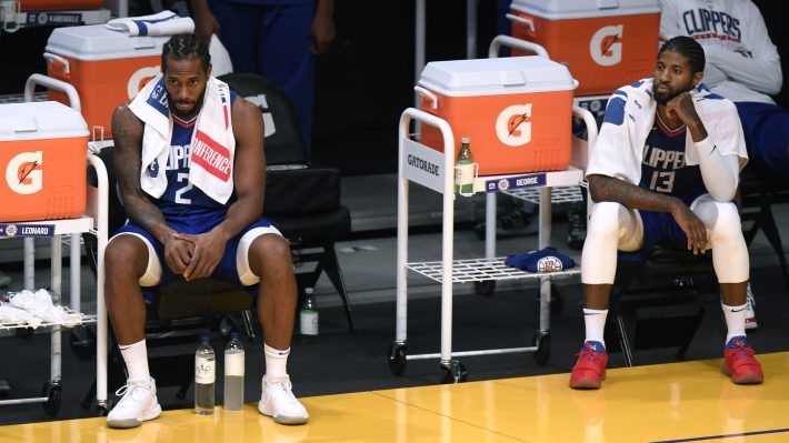 Kawhi Leonard and Paul George of the Los Angeles Clippers sit hilariously far apart on the sideline