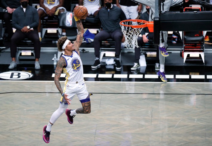 NEW YORK, NEW YORK - DECEMBER 22: Kelly Oubre Jr. #12 of the Golden State Warriors dunks during the first half against the Brooklyn Nets at Barclays Center on December 22, 2020 in the Brooklyn borough of New York City. NOTE TO USER: User expressly acknowledges and agrees that, by downloading and/or using this photograph, user is consenting to the terms and conditions of the Getty Images License Agreement. (Photo by Sarah Stier/Getty Images)