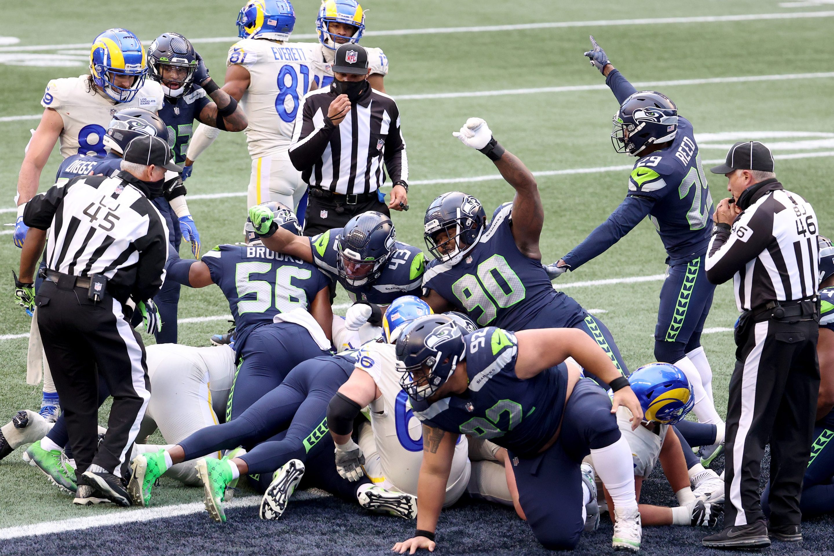 The Seattle Seahawks defense celebrates a stop on third down