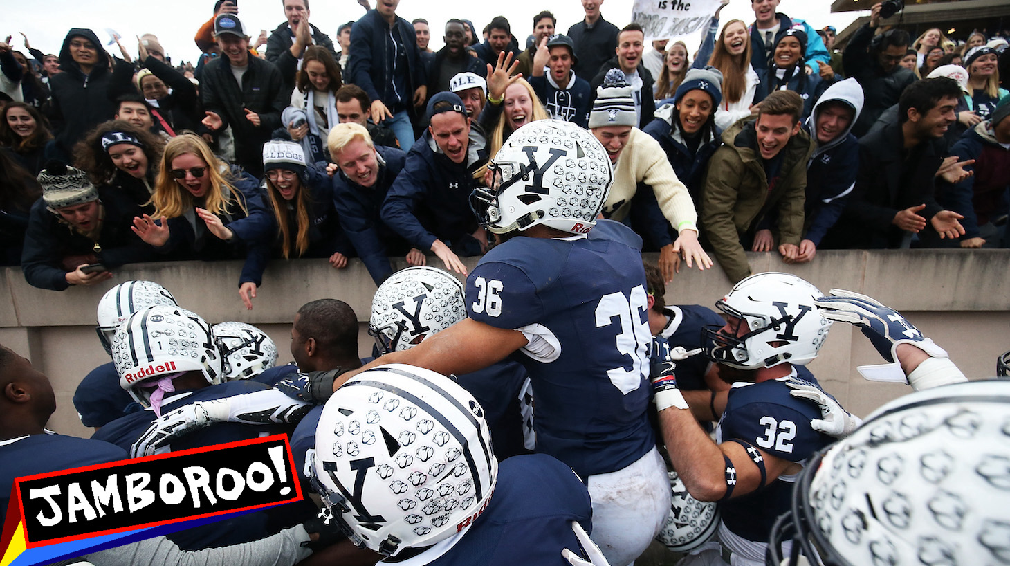 NEW HAVEN, CT - NOVEMBER 18: Deonte Henson #21 of the Yale Bulldogs is congratulated by teammates after making an interception in teh fourth quarter of a game against the Harvard Crimson at the Yale Bowl on November 18, 2017 in New Haven, Connecticut. (Photo by Adam Glanzman/Getty Images)