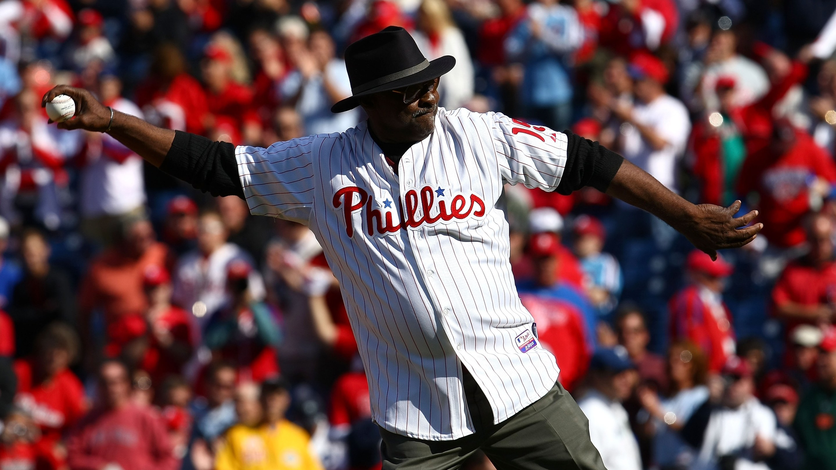 Dick Allen, stylish to the last, throws out the first pitch at a Phillies game in 2009.