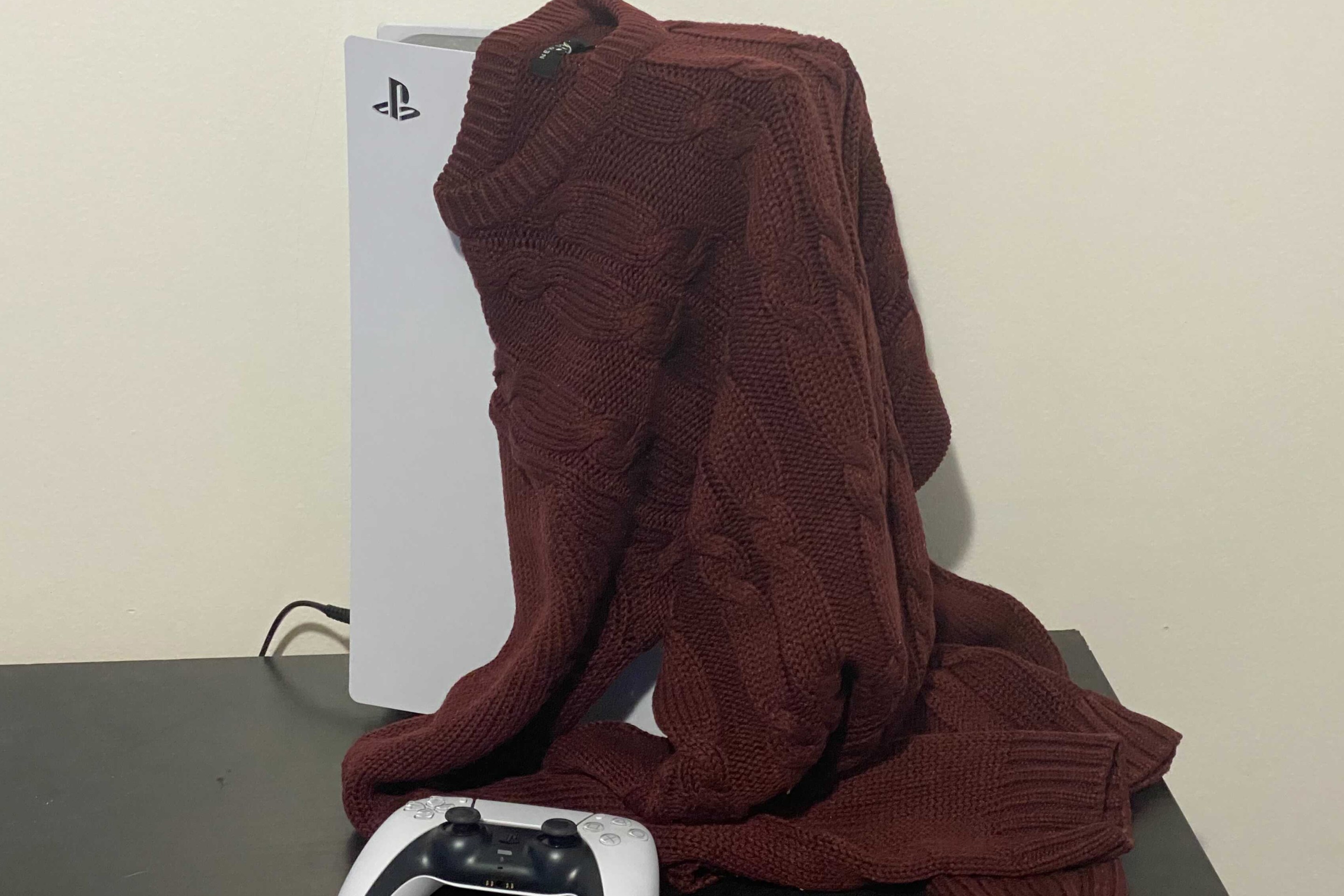 Sweater draped over a useless PS5