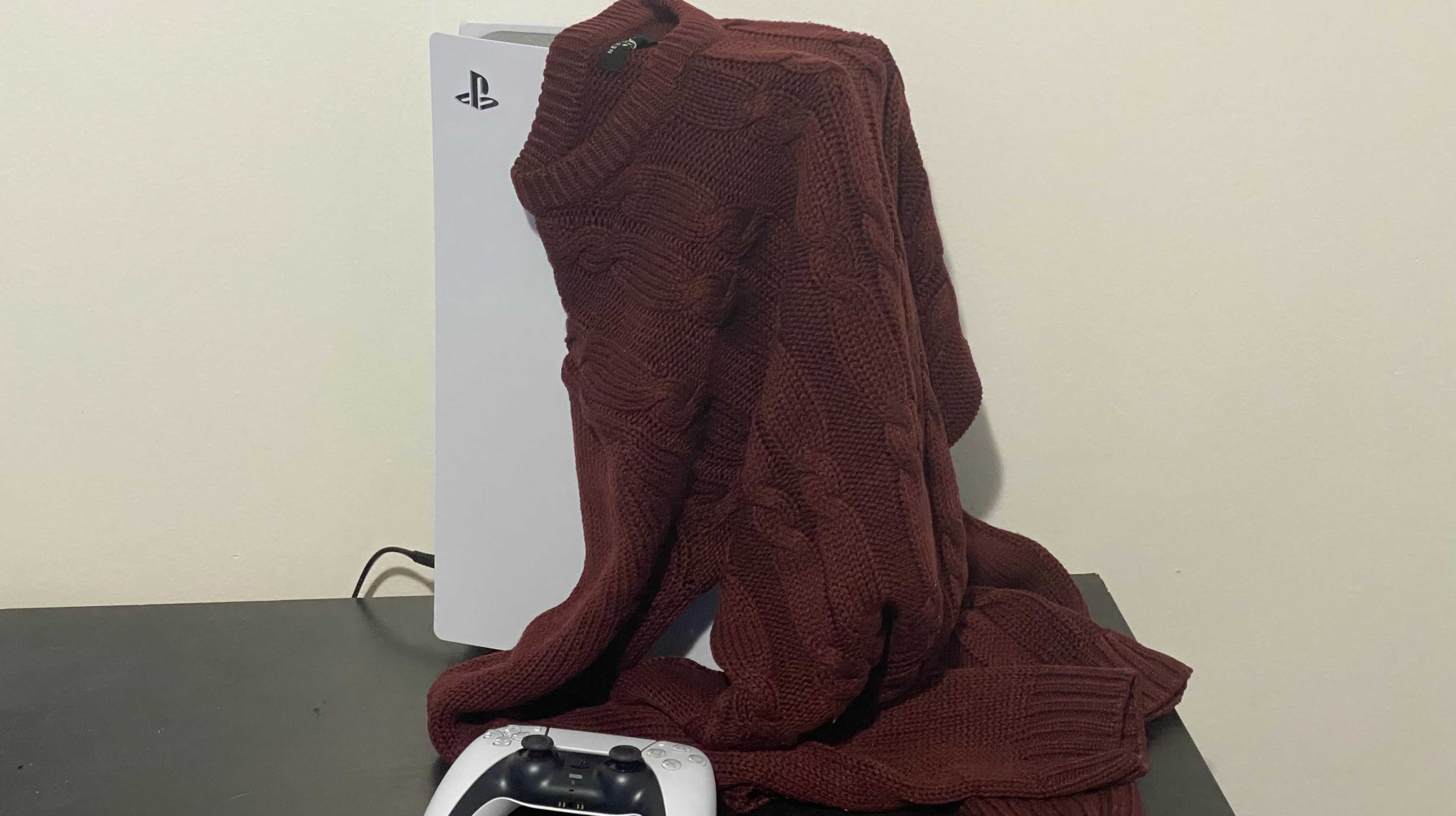 Sweater draped over a useless PS5