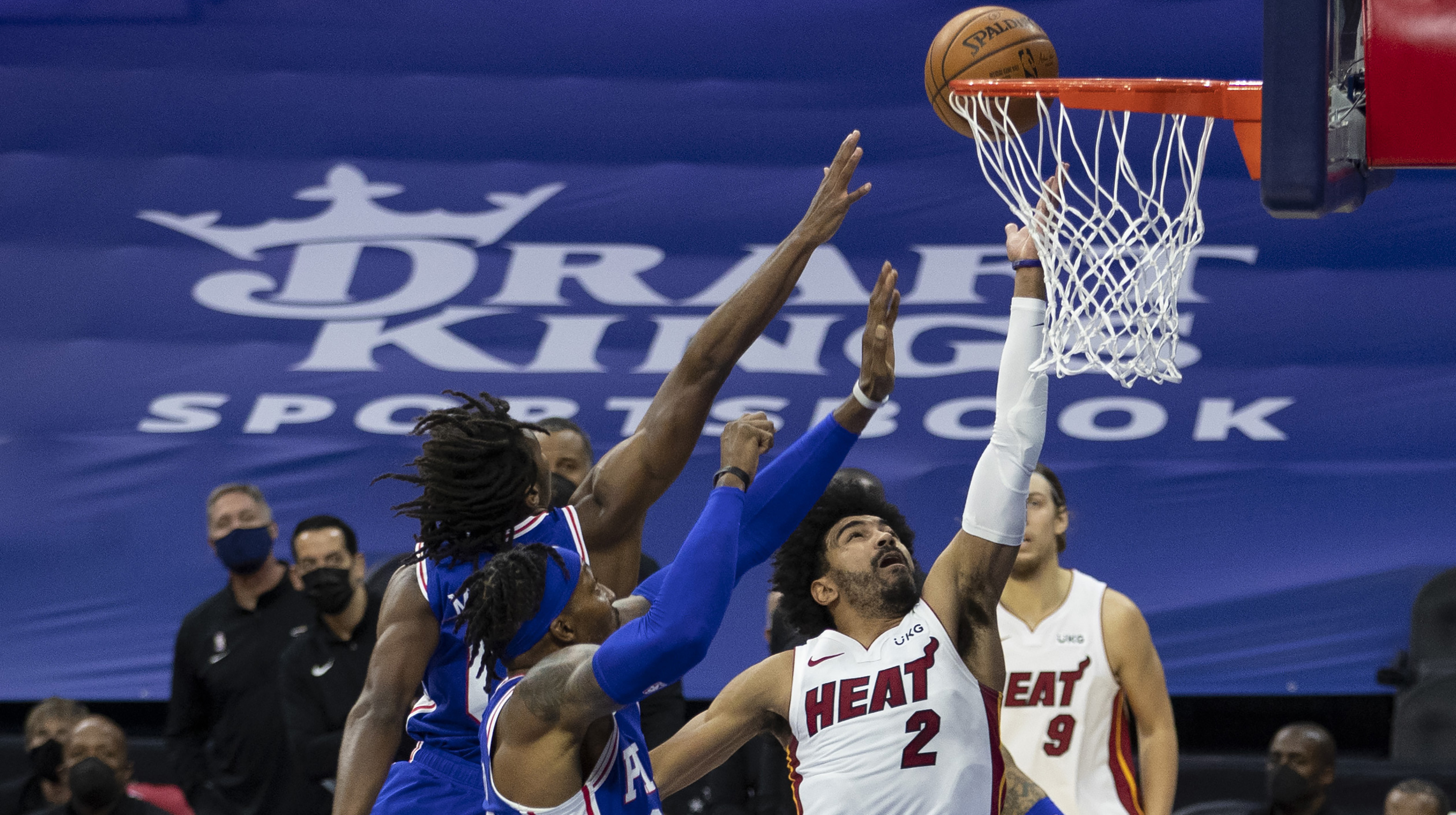 Gabe Vincent #2 of the Miami Heat shoots the ball against Tyrese Maxey #0 and Dwight Howard #39 of the Philadelphia 76ers in the second quarter during their game at the Wells Fargo Center on January 12, 2021 in Philadelphia, Pennsylvania.