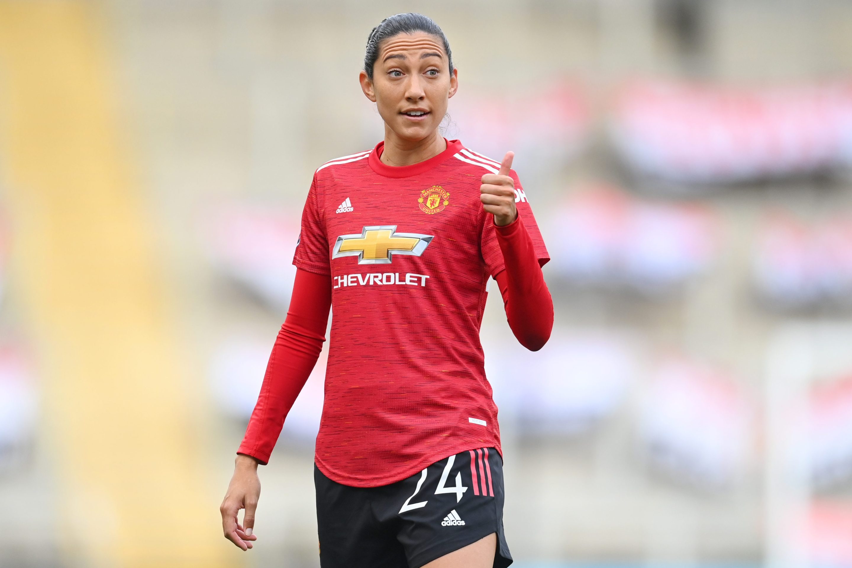 Christen Press of Manchester United looks on and gives a thumbs up during the Barclays FA Women's Super League match between Manchester United Women and Manchester City Women at Leigh Sports Village on November 14, 2020 in Leigh, England.