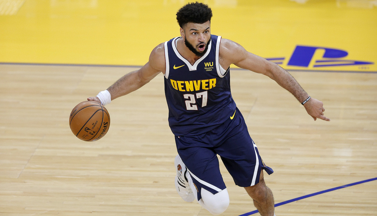 SAN FRANCISCO, CALIFORNIA - DECEMBER 12: Jamal Murray #27 of the Denver Nuggets in action against the Golden State Warriors during their NBA preseason game at Chase Center on December 12, 2020 in San Francisco, California. NOTE TO USER: User expressly acknowledges and agrees that, by downloading and or using this photograph, User is consenting to the terms and conditions of the Getty Images License Agreement. (Photo by Ezra Shaw/Getty Images)