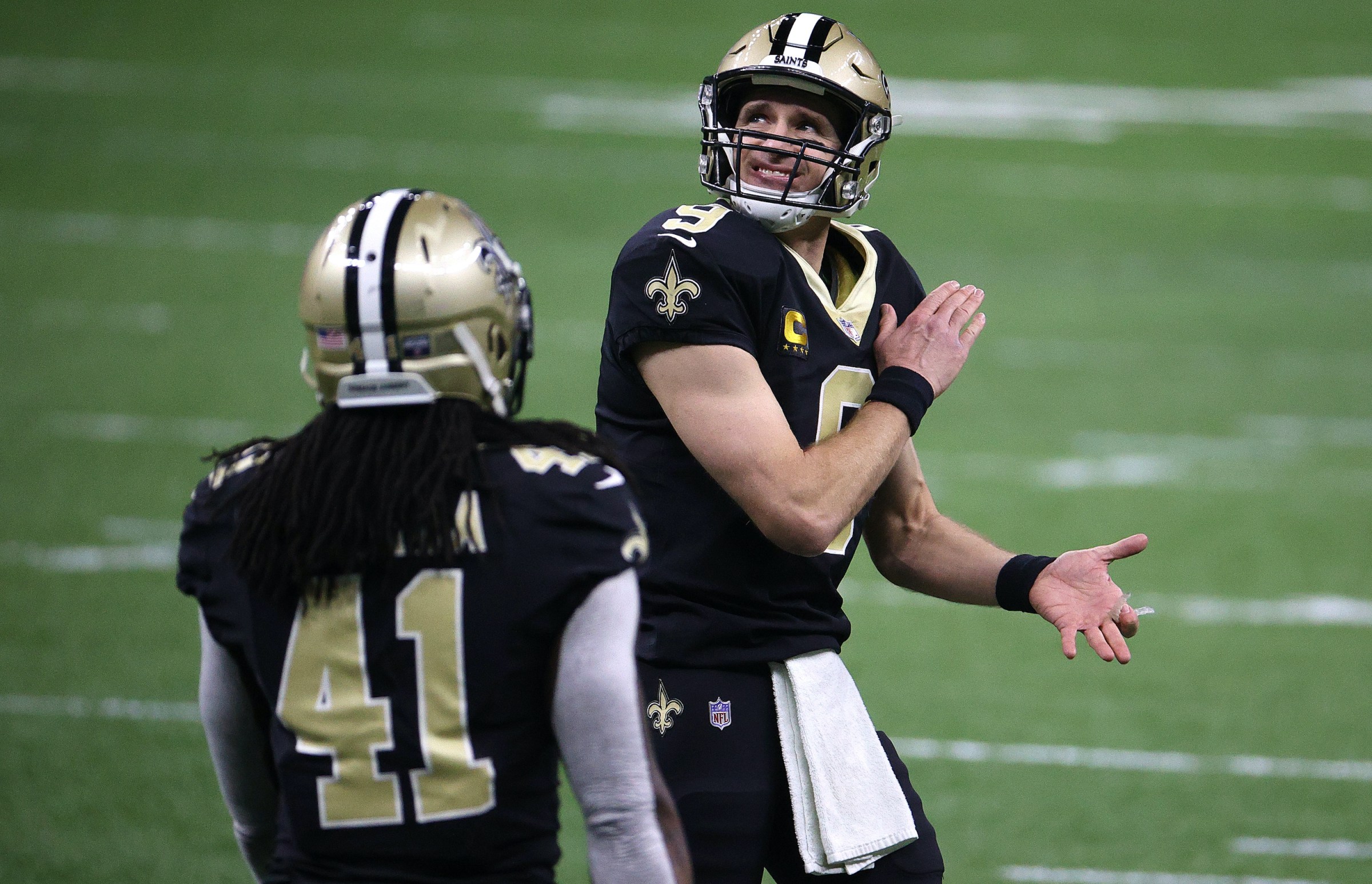 Drew Brees #9 of the New Orleans Saints reacts to a play against the Tampa Bay Buccaneers during the first quarter in the NFC Divisional Playoff game at Mercedes Benz Superdome on January 17, 2021 in New Orleans, Louisiana.
