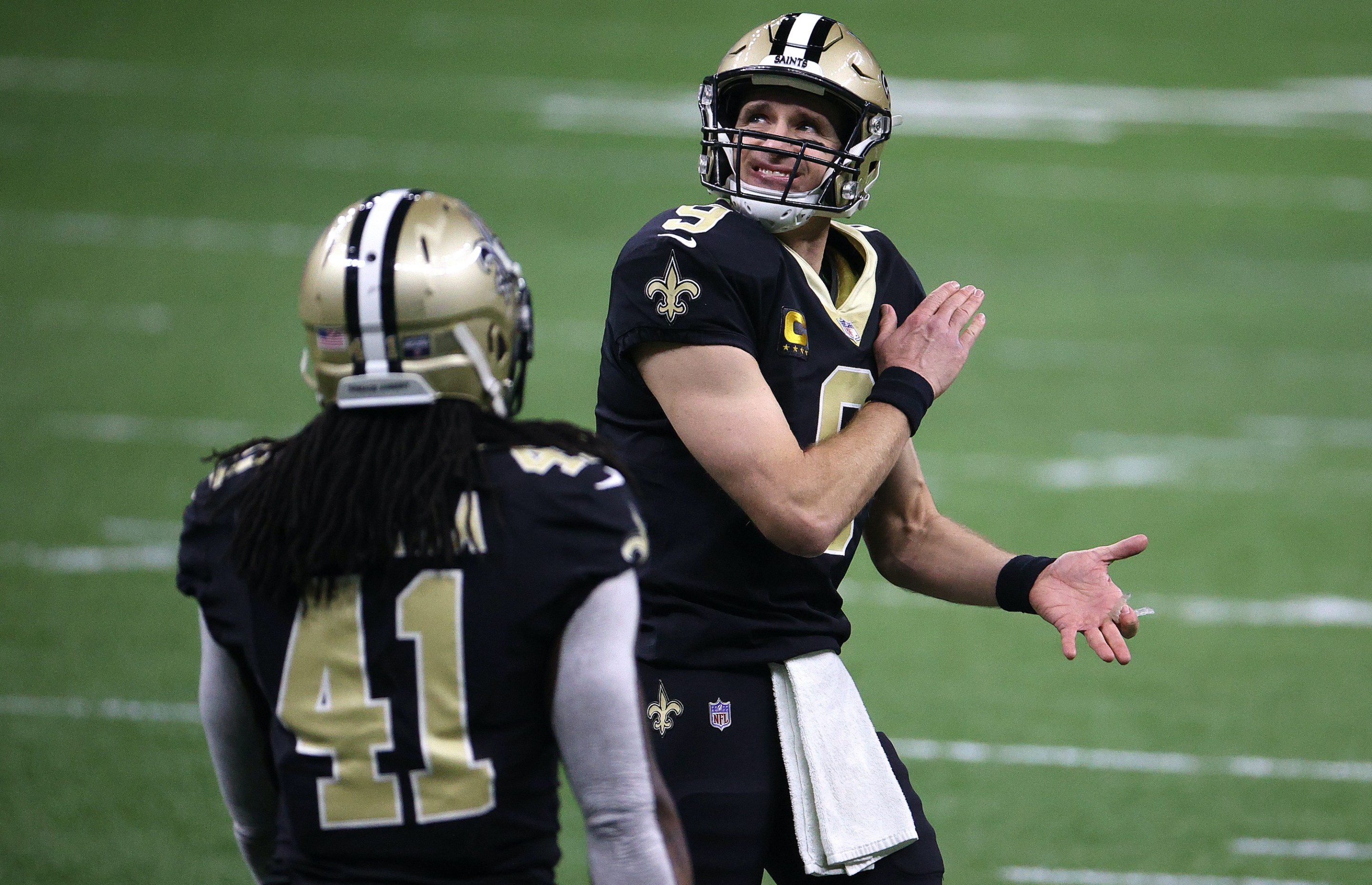 Drew Brees #9 of the New Orleans Saints reacts to a play against the Tampa Bay Buccaneers during the first quarter in the NFC Divisional Playoff game at Mercedes Benz Superdome on January 17, 2021 in New Orleans, Louisiana.