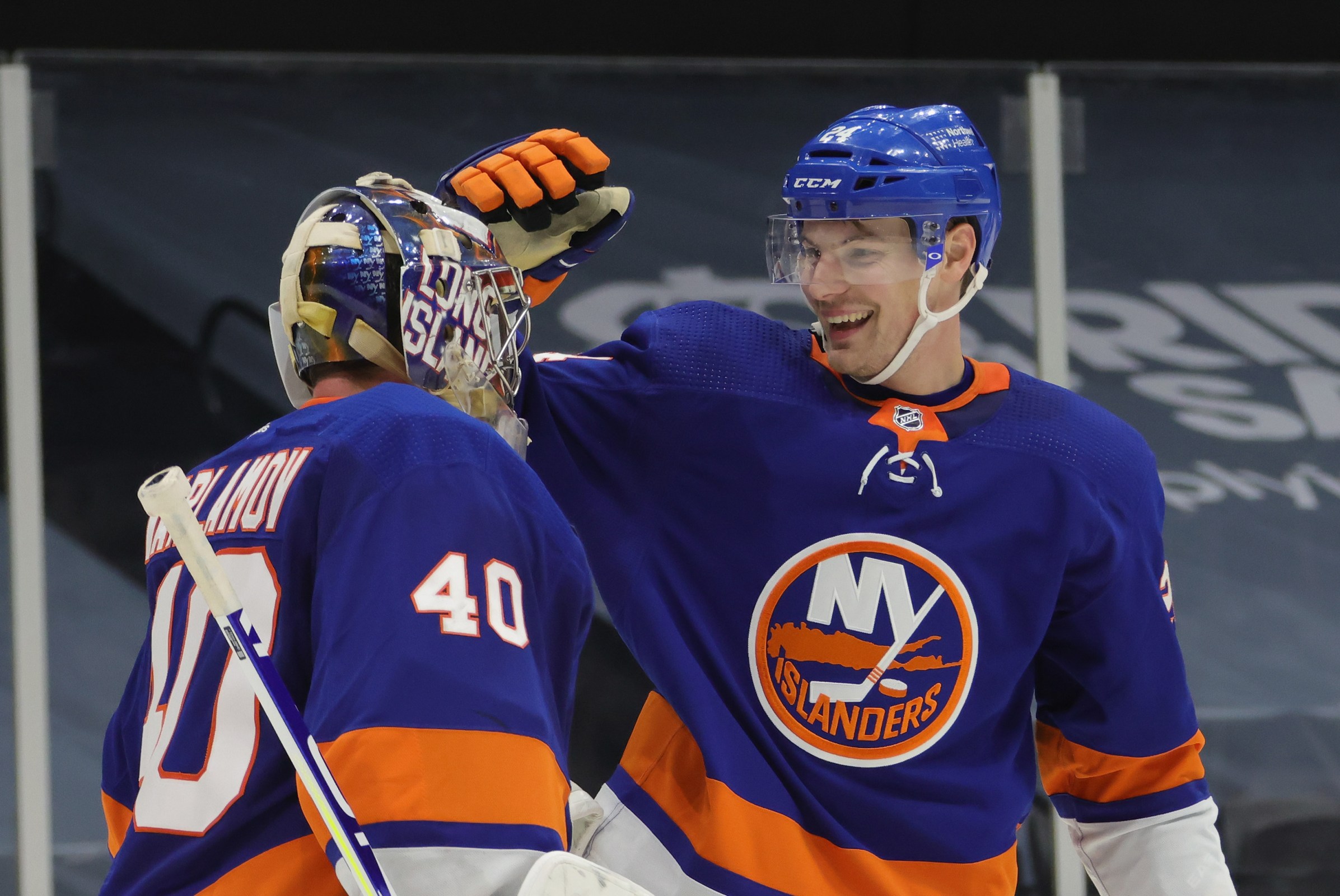 Semyon Varlamov #40 and Scott Mayfield #24 of the New York Islanders celebrate