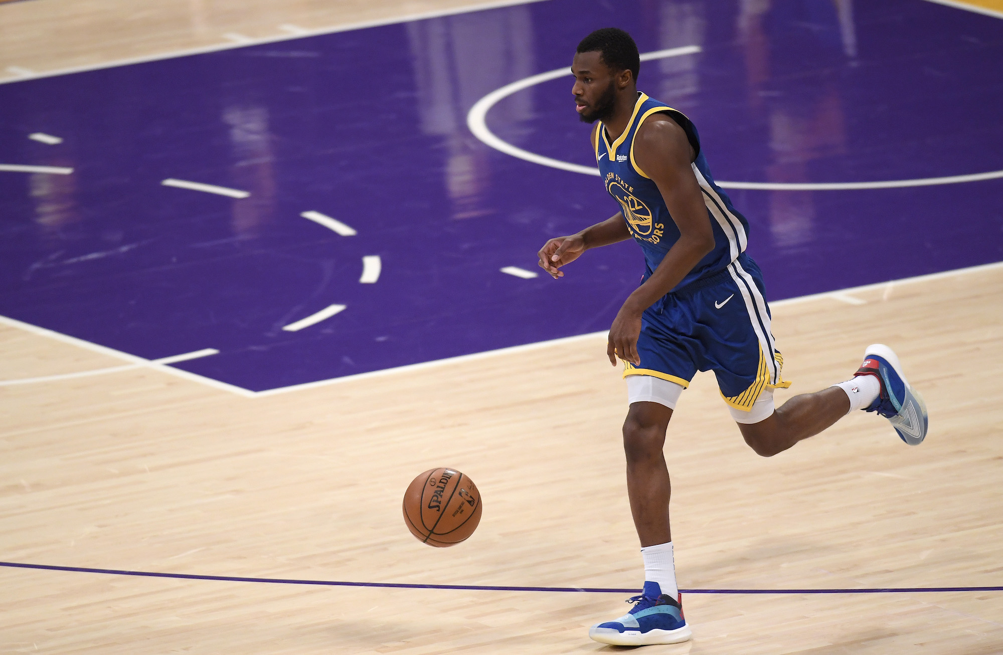 LOS ANGELES, CALIFORNIA - JANUARY 18: Andrew Wiggins #22 of the Golden State Warriors brings the ball up court during a 115-113 Warrior win over the Los Angeles Lakers on Martin Luther King Jr. Day at Staples Center on January 18, 2021 in Los Angeles, California. NOTE TO USER: User expressly acknowledges and agrees that, by downloading and/or using this Photograph, user is consenting to the terms and conditions of the Getty Images License Agreement. Mandatory Copyright Notice: Copyright 2021 NBAE (Photo by Harry How/Getty Images)