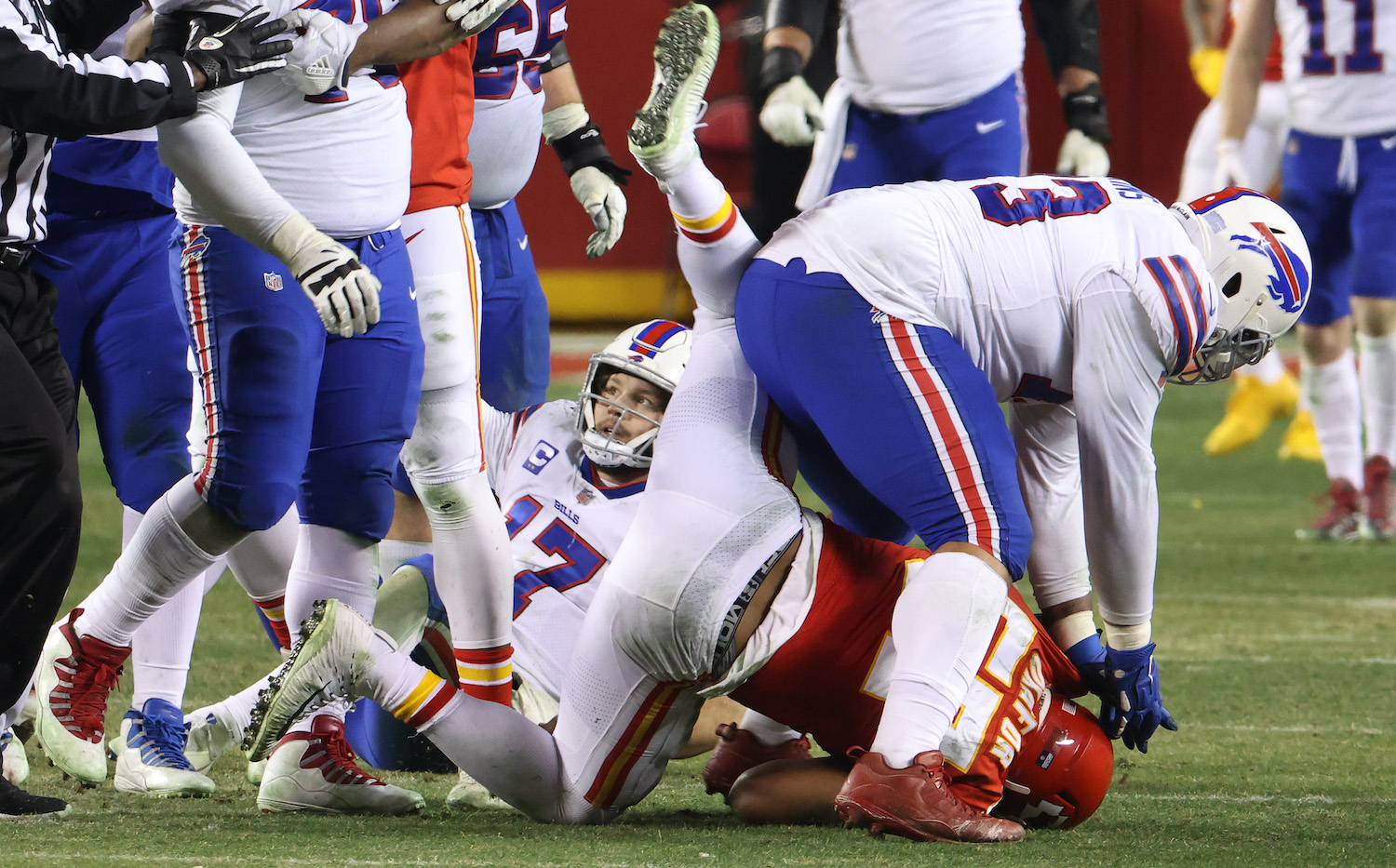 KANSAS CITY, MISSOURI - JANUARY 24: Dion Dawkins #73 of the Buffalo Bills hits Alex Okafor #57 of the Kansas City Chiefs after a play in the fourth quarter during the AFC Championship game at Arrowhead Stadium on January 24, 2021 in Kansas City, Missouri. (Photo by Jamie Squire/Getty Images)