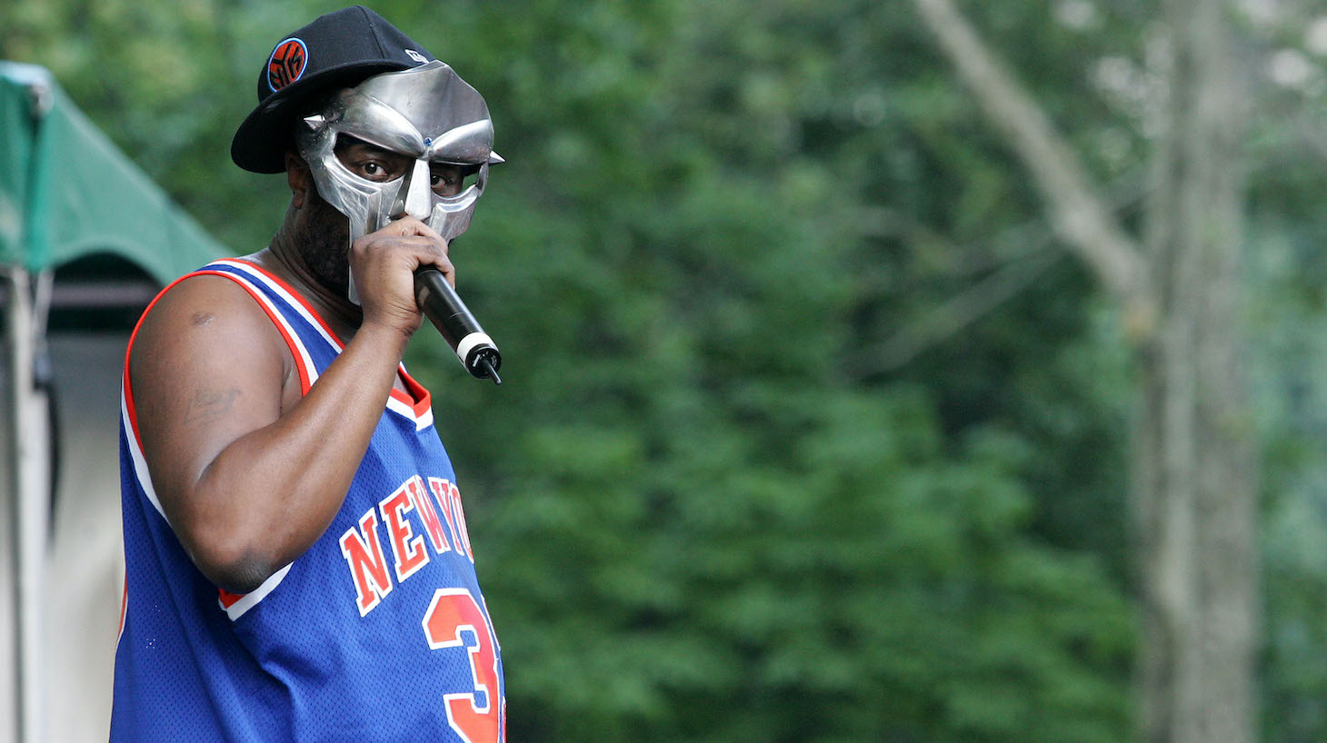 Rapper MF DOOM performs at a benefit concert for the Rhino Foundation at Central Park's Rumsey Playfield on June 28, 2005 in New York City.