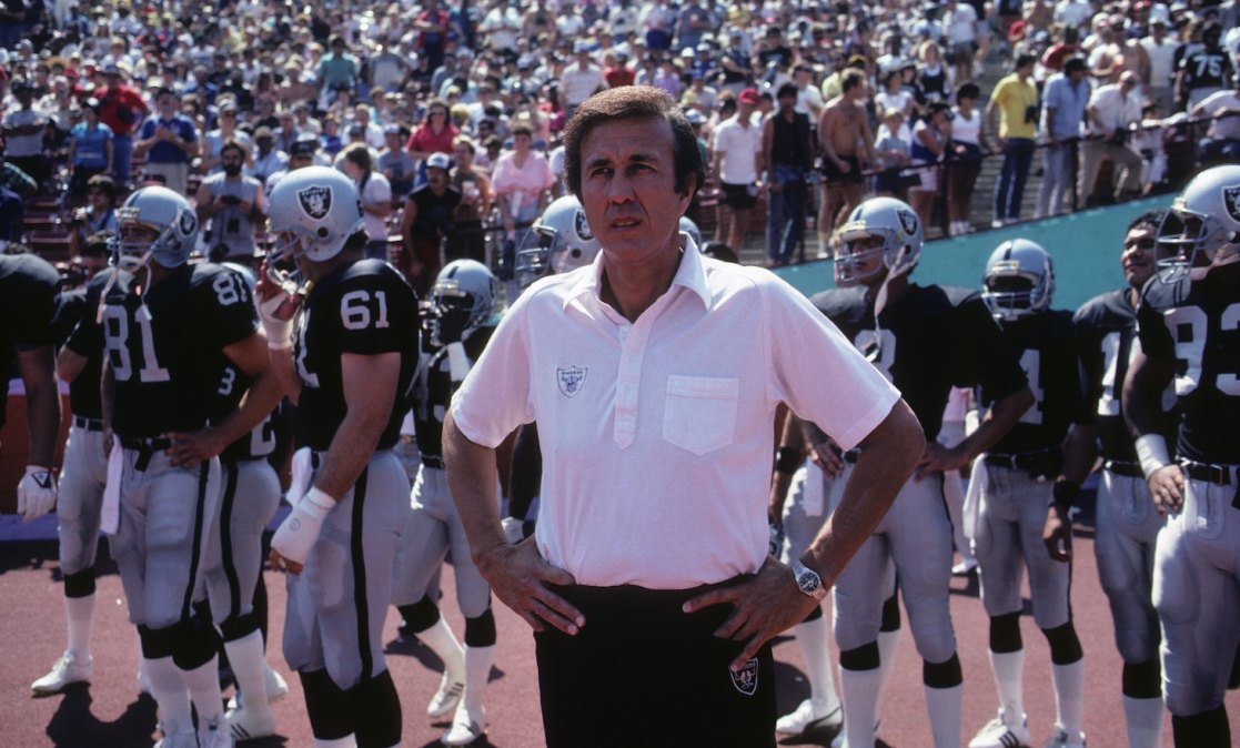 LOS ANGELES - SEPTEMBER 22: Head coach Tom Flores of the Los Angeles Raiders and his crew stand on the side lines during the game against the San Francisco 49ers at the Los Angeles Memorial Coliseum on September 22, 1985 in Los Angeles, California. The 49ers won 34-10. (Photo by George Rose/Getty Images)