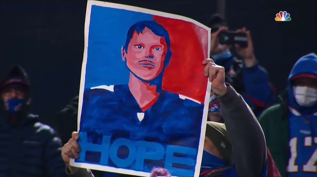 A Buffalo Bills fan holds up a very bad drawing of quarterback Josh Allen.