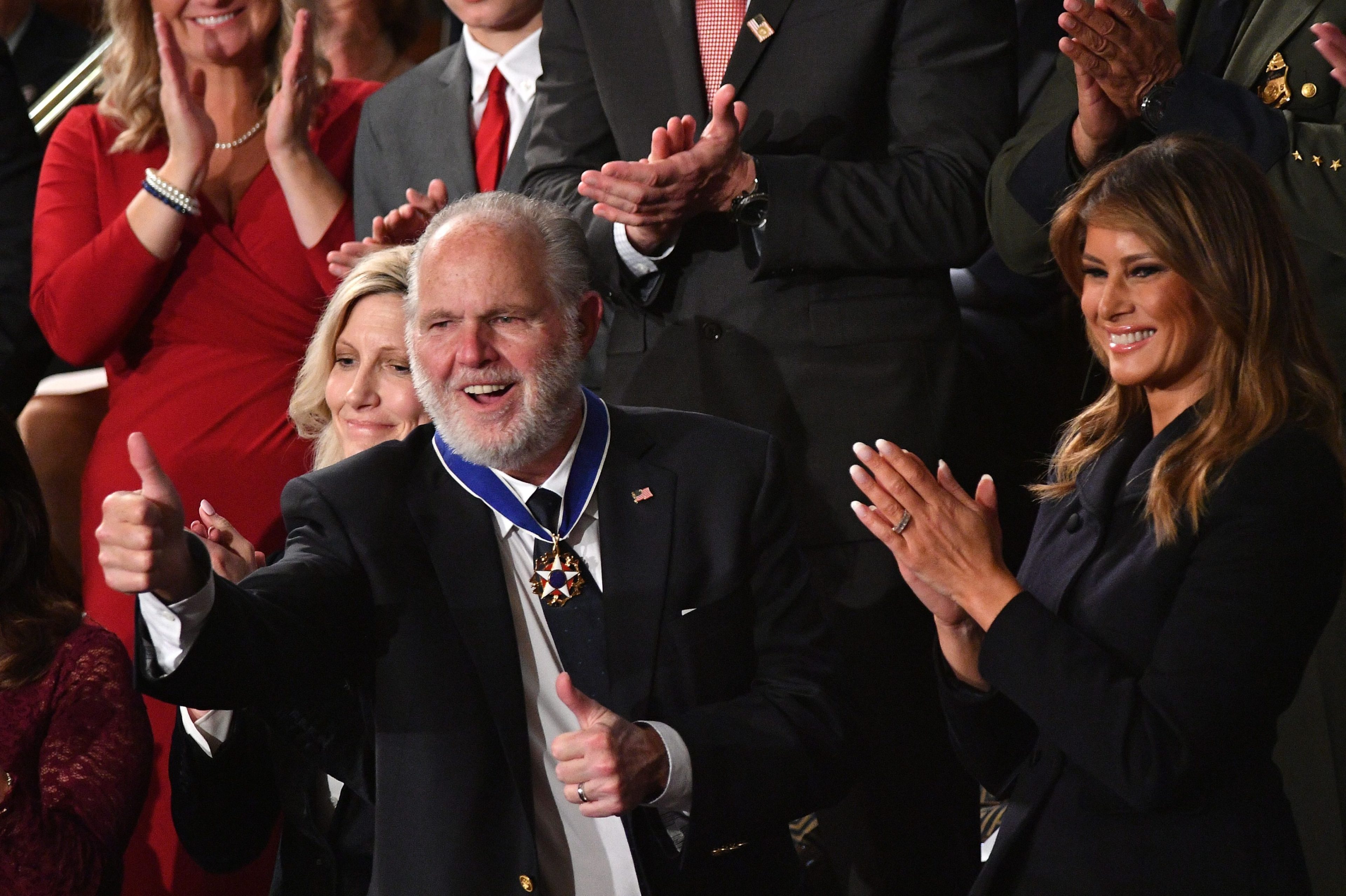 Rush Limbaugh, who has since died, celebrates after receiving the Presidential Medal of Freedom.