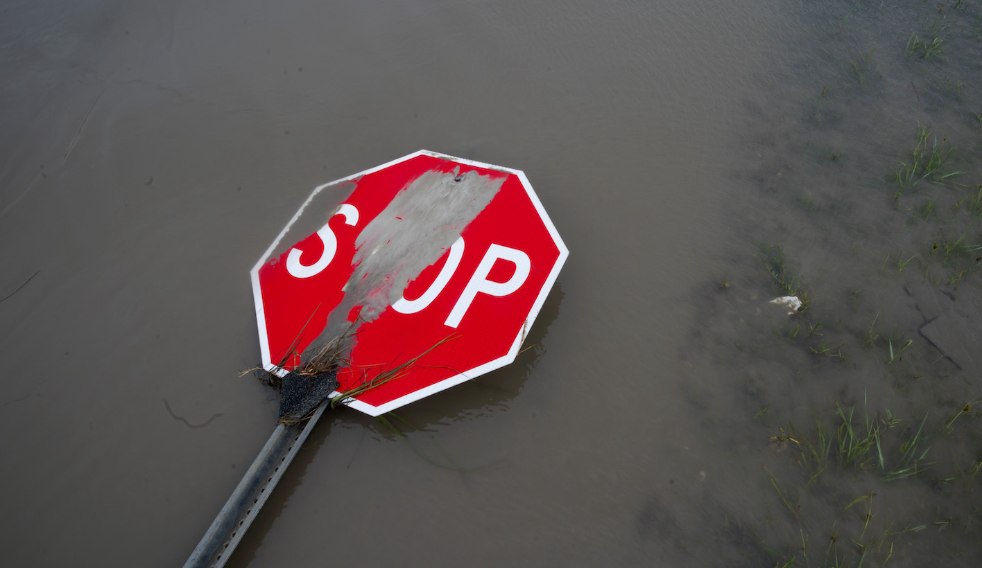 HOLLY BEACH, LA - AUGUST 27: A damaged stop sign sit among flood water after Hurricane Laura passed through the area August 27, 2020 in Holly Beach, Louisiana. Hurricane Laura came ashore bringing rain and high winds to the South East region of the state causing extensive damage to the area. (Photo by Eric Thayer/Getty Images)