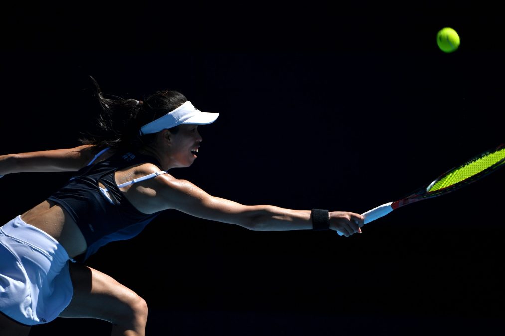 Taiwan's Su-Wei Hsieh hits a return against Bianca Andreescu of Canada during their women's singles match on day three of the Australian Open tennis tournament in Melbourne on February 10, 2021.