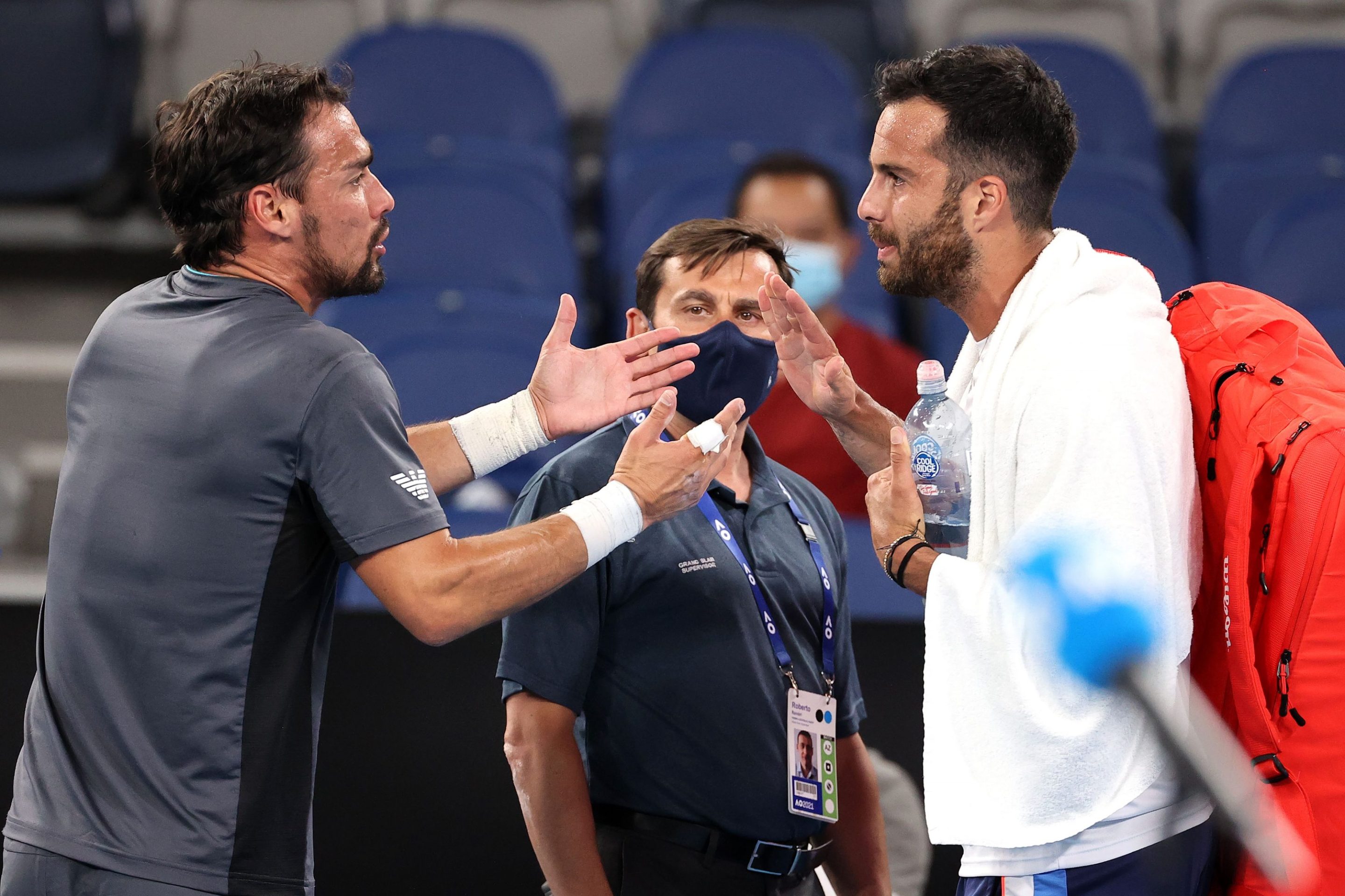 Fabio Fognini and Salvatore Caruso argue after their Australian Open match.