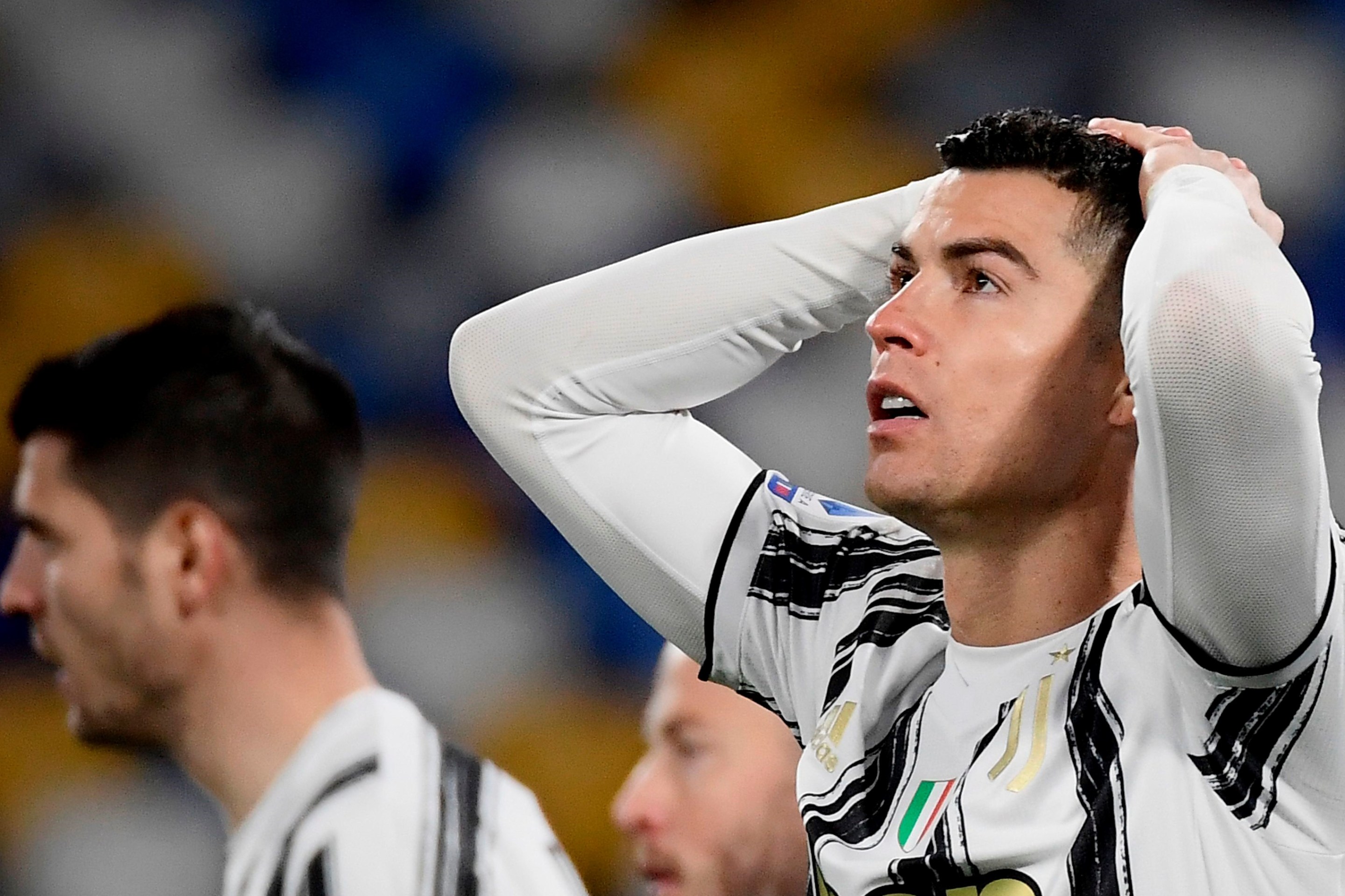 Juventus' Portuguese forward Cristiano Ronaldo reacts after missing a goal opportunity during the Italian Serie A football match Napoli vs Juventus on February 13, 2021 at the Diego Maradona (San Paolo) stadium in Naples.