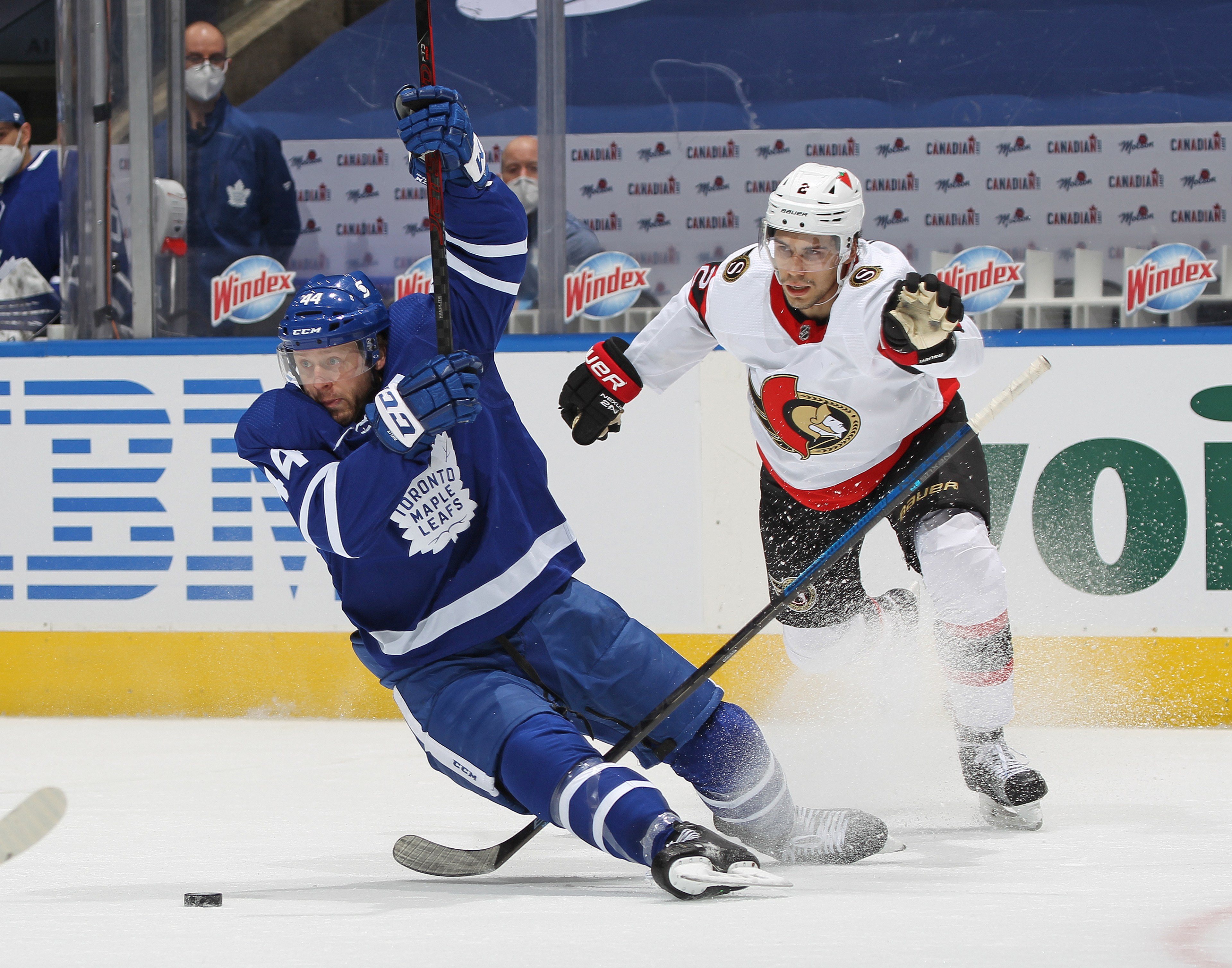 Artem Zub #2 of the Ottawa Senators draws a penalty for pulling down Morgan Rielly #44 of the Toronto Maple Leafs