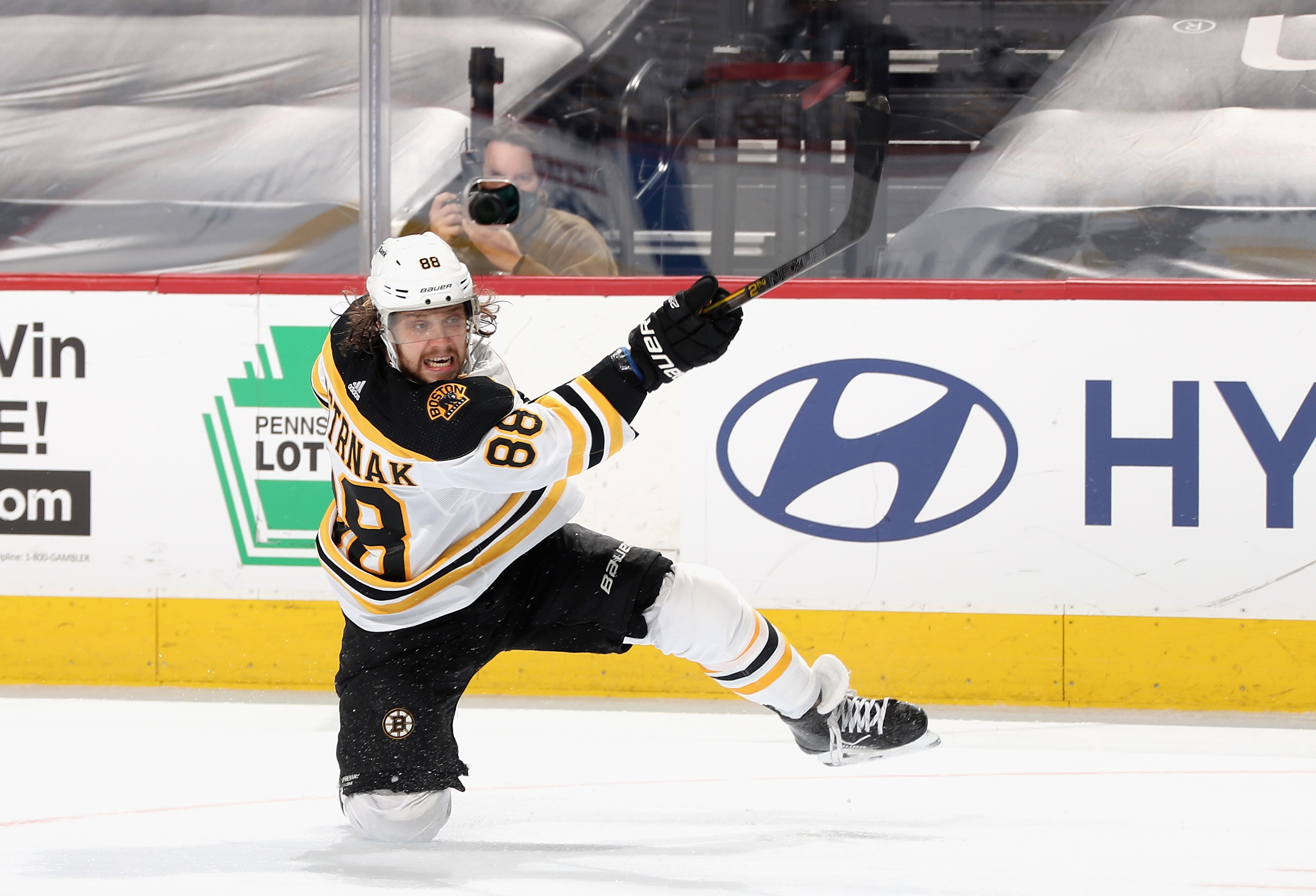 David Pastrnak #88 of the Boston Bruins takes a slapshot