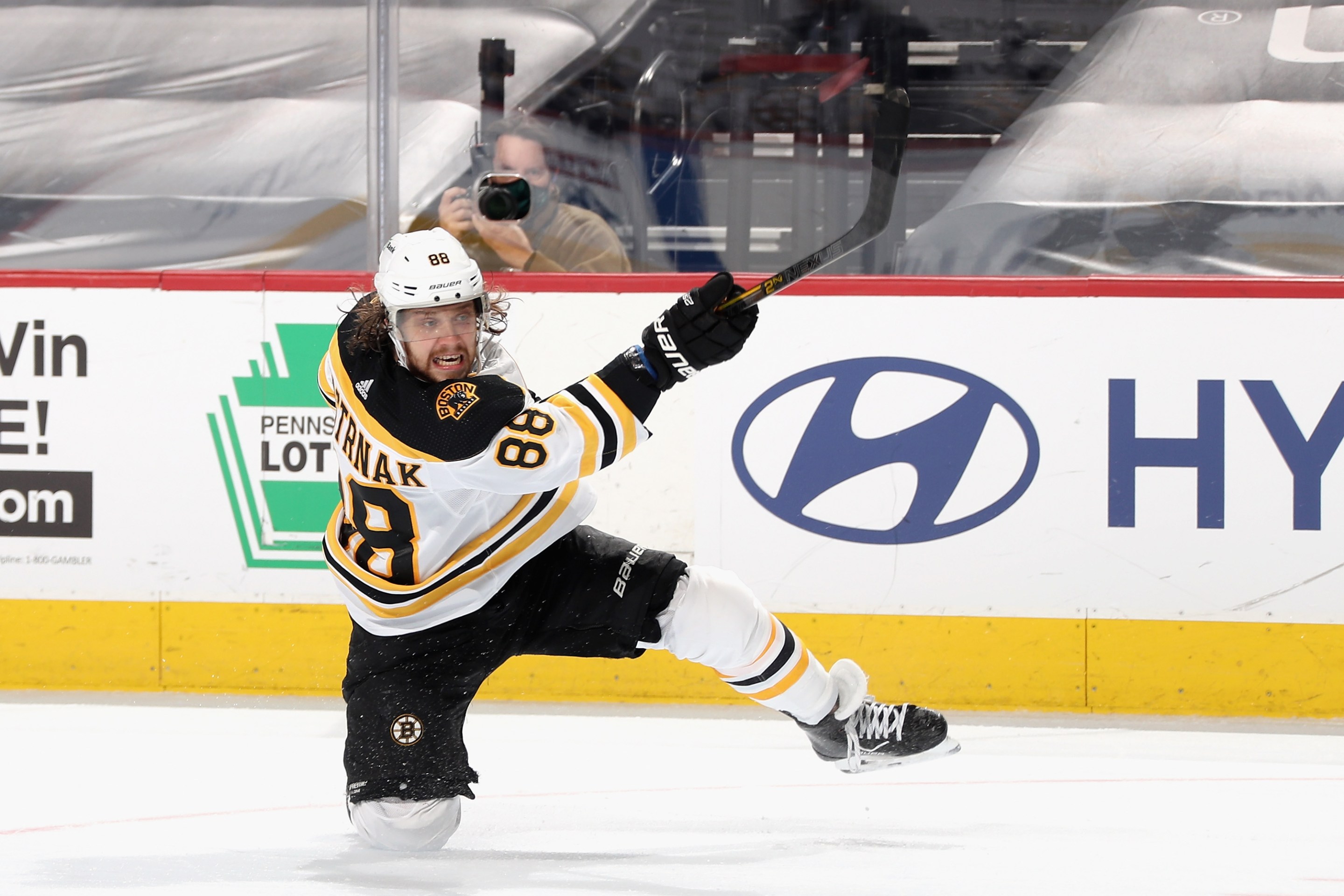 David Pastrnak #88 of the Boston Bruins takes a slapshot