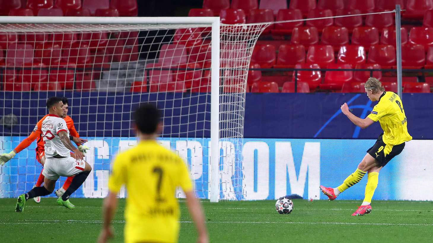 Erling Haaland of Borussia Dortmund scores their side's third goal during the UEFA Champions League Round of 16 match between Sevilla FC and Borussia Dortmund at Estadio Ramon Sanchez Pizjuan on February 17, 2021 in Seville, Spain. Sporting stadiums around Spain remain under strict restrictions due to the Coronavirus Pandemic as Government social distancing laws prohibit fans inside venues resulting in games being played behind closed doors.