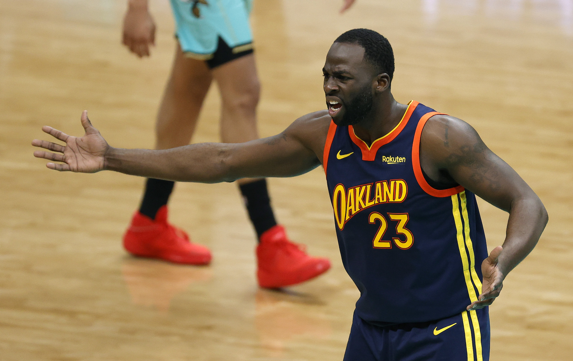 CHARLOTTE, NORTH CAROLINA - FEBRUARY 20: Draymond Green #23 of the Golden State Warriors reacts following a call during the fourth quarter of their game against the Charlotte Hornets at Spectrum Center on February 20, 2021 in Charlotte, North Carolina. NOTE TO USER: User expressly acknowledges and agrees that, by downloading and or using this photograph, User is consenting to the terms and conditions of the Getty Images License Agreement. (Photo by Jared C. Tilton/Getty Images)