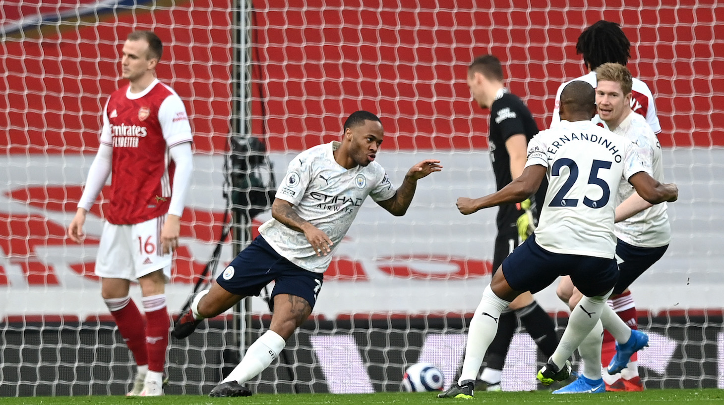 Raheem Sterling of Manchester City celebrates after scoring his team's first goal during the Premier League match between Arsenal and Manchester City at Emirates Stadium on February 21, 2021 in London, England.