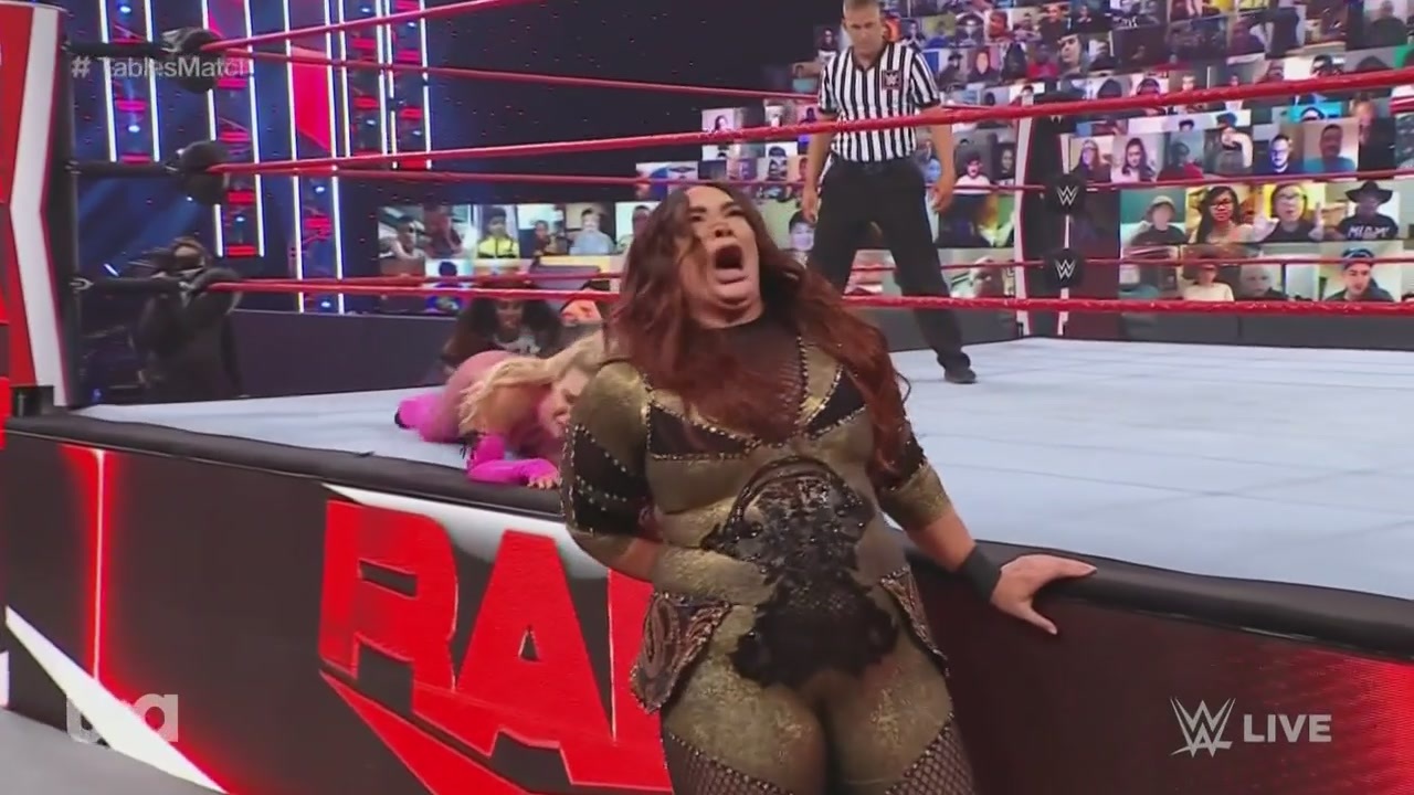 Nia Jax yells "my hole!" after landing hard on the ring apron during WWE Monday Night Raw