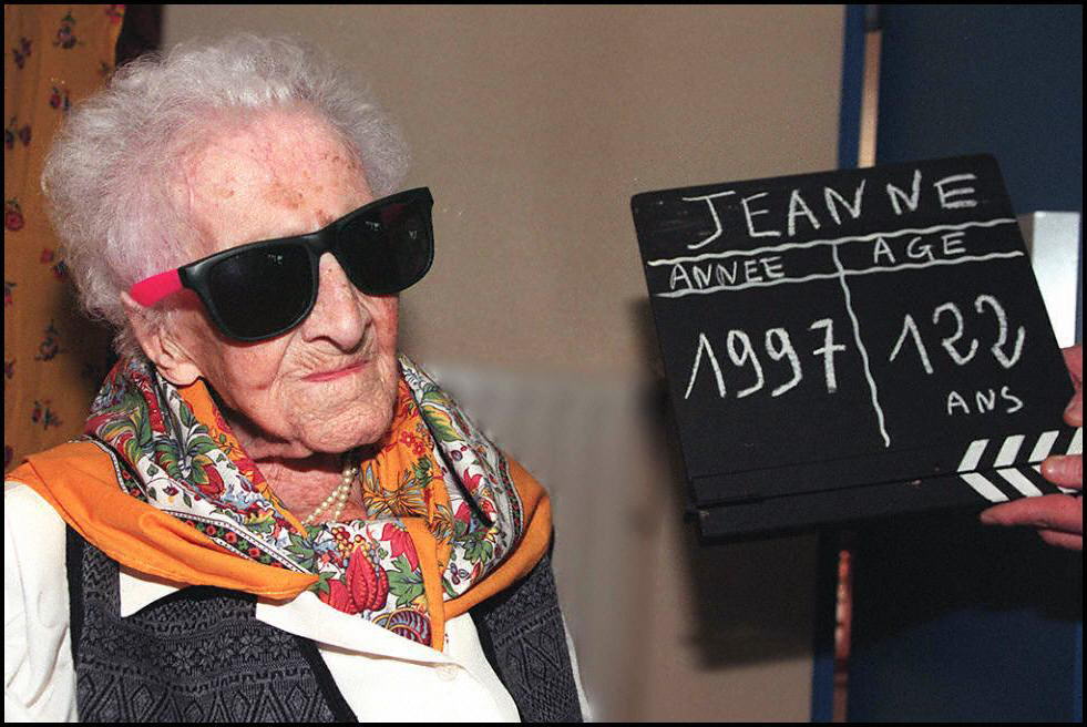 Jeanne Calment, the world's oldest woman, poses for photographers 20 February in Arles, southern France, a day prior her birthday. Calment will celebrate on Friday her 122nd birthday. (Photo by Georges GOBET / AFP) (Photo credit should read GEORGES GOBET/AFP via Getty Images)