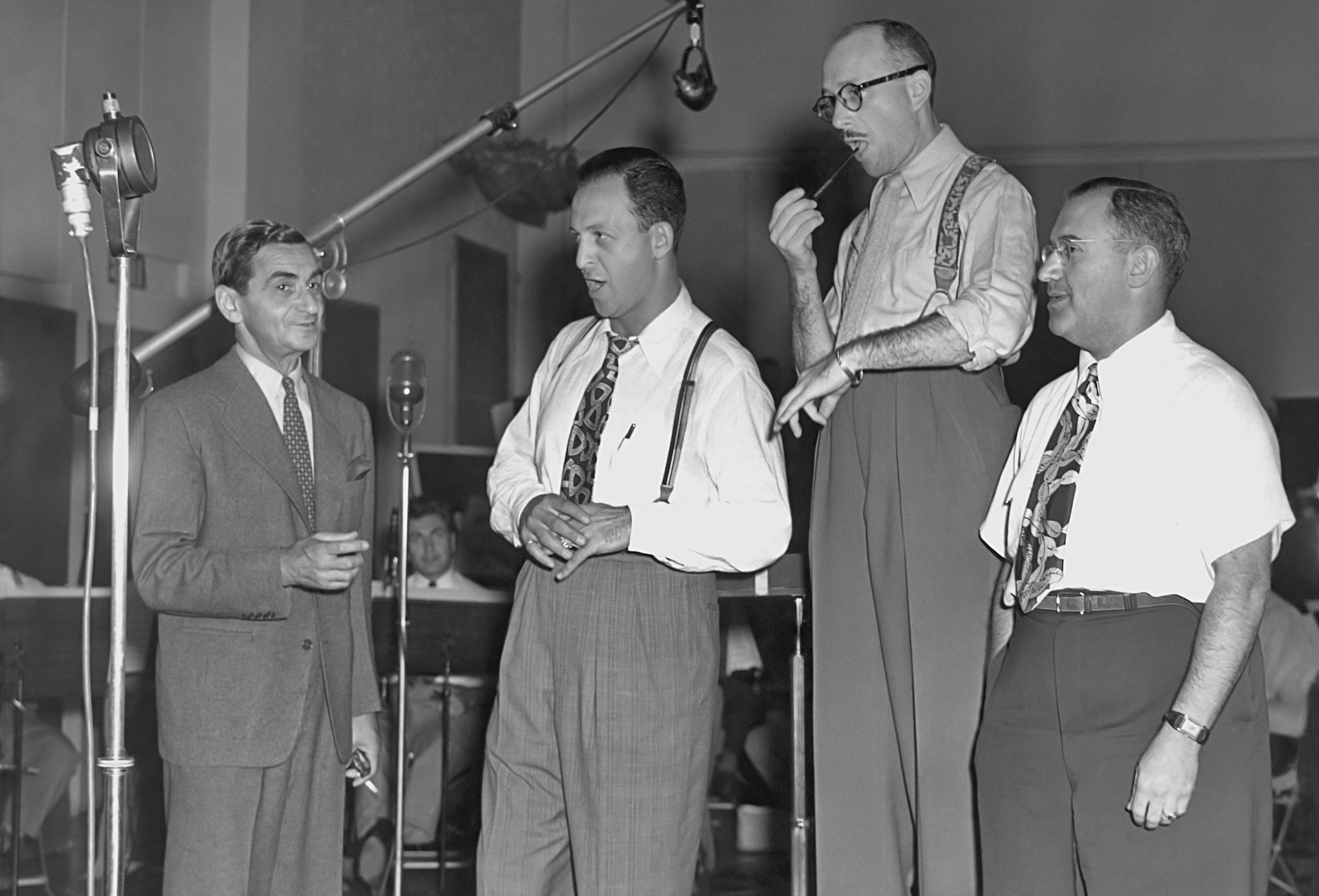 Composer Irving Berlin (1888 Ð 1989) with singer Barry Wood (1909 - 1970) and orchestra leader Ray Bloch (1902 - 1982) recording a song in the 1940's. (Photo by Archive Photos/Getty Images)