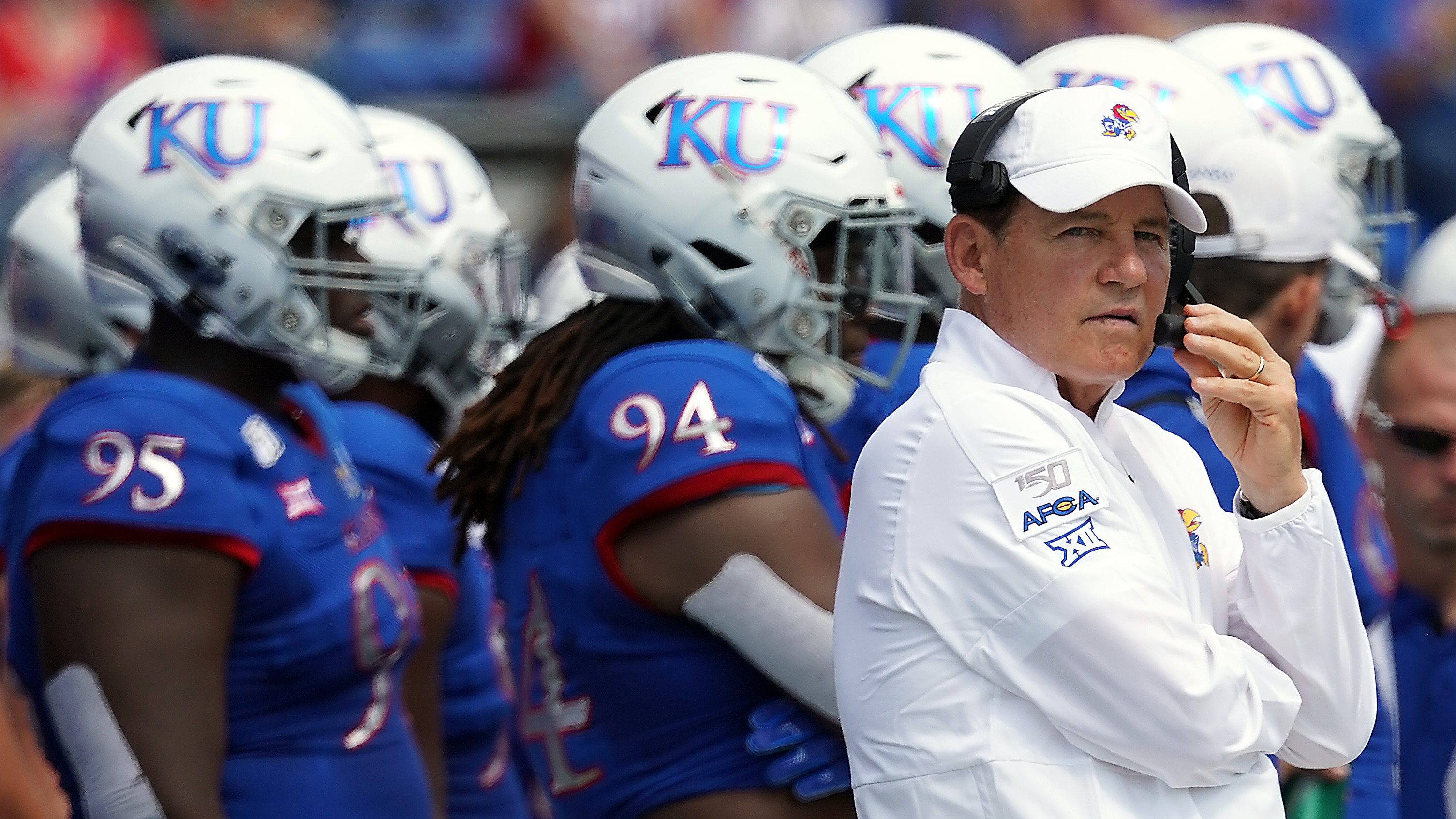 Former head coach Les Miles of the Kansas Jayhawks watches from the sidelines during the game against the Indiana State Sycamores at Memorial Stadium on August 31, 2019 in Lawrence, Kansas.