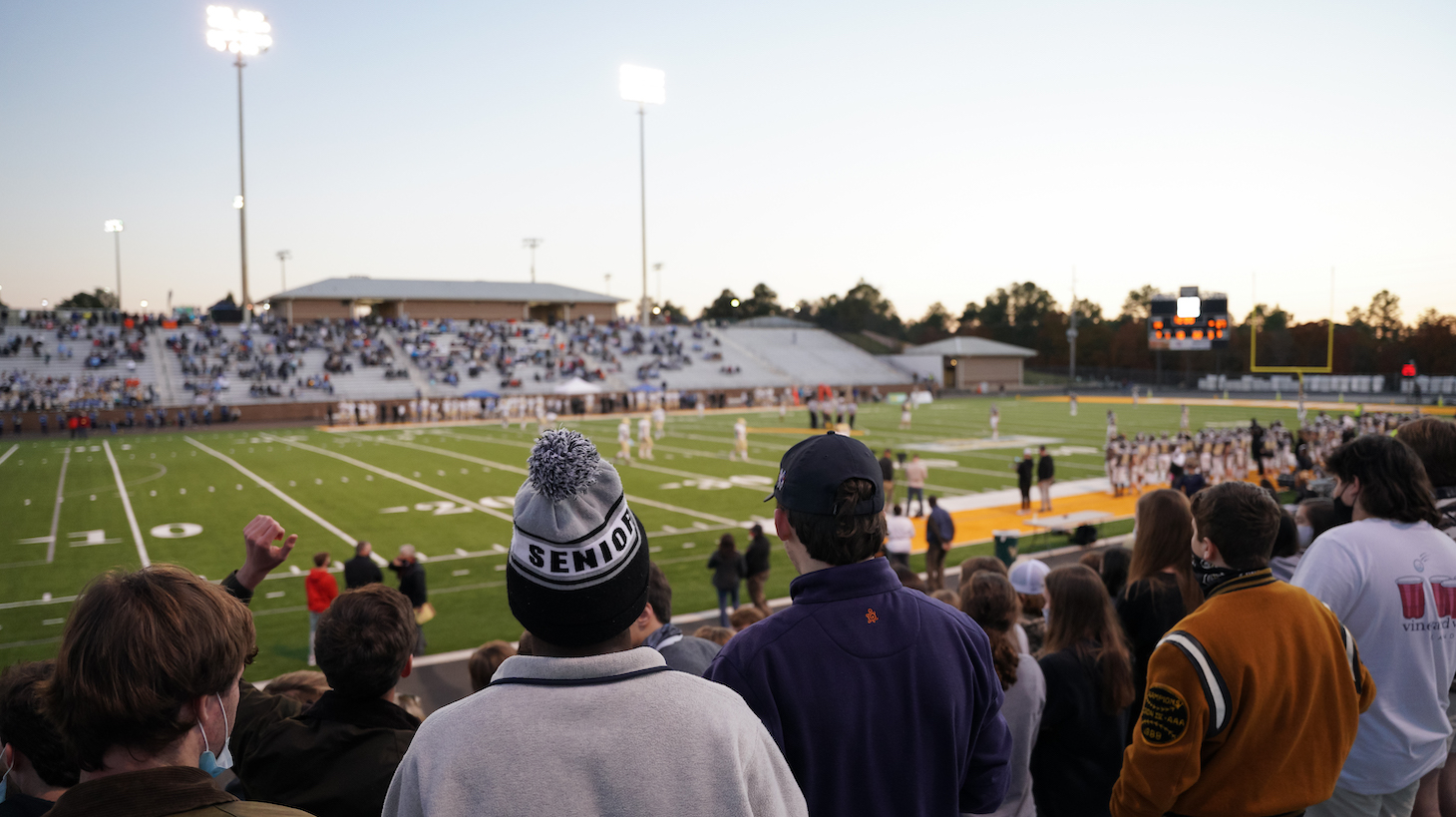 COLUMBIA, SC - DECEMBER 05: Camden High School students watch the South Carolina High School League Class AAA football championship game at Spring Valley High School on December 5, 2020 in Columbia, South Carolina. The Class AA championship game, between Abbeville and Marion originally scheduled for December 4, was postponed after a team quarantine for COVID-19. (Photo by Sean Rayford/Getty Images)