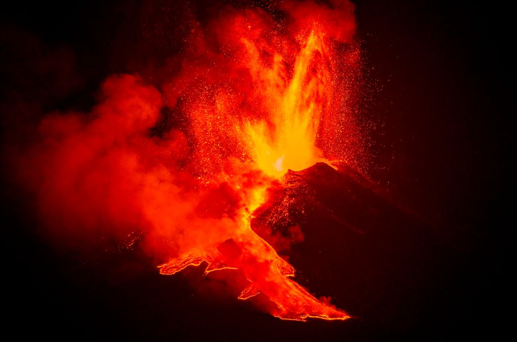 Lava flows down from the peak of Mount Etna in Sicily