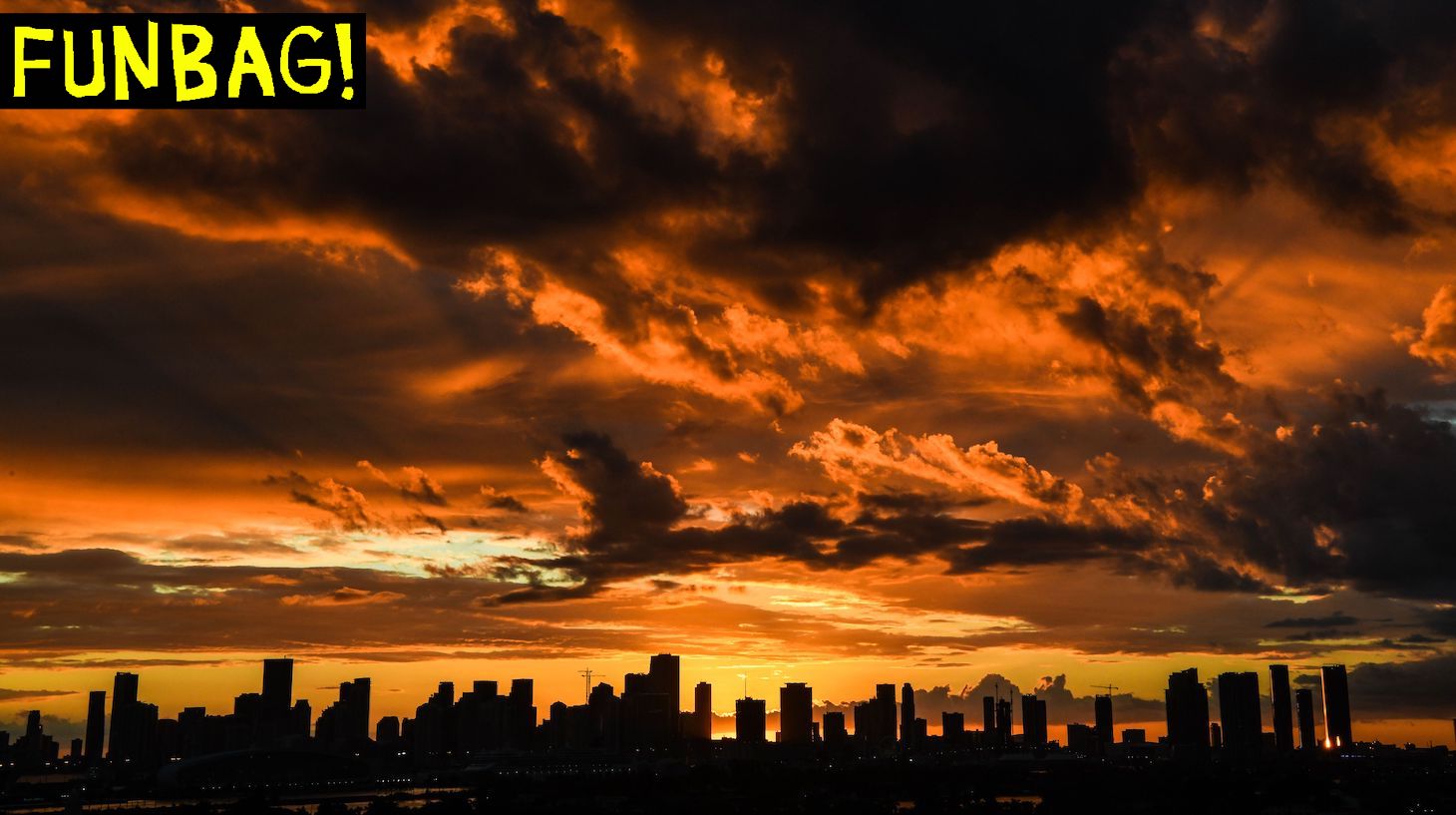 TOPSHOT - The Miami skyline is seen as the sun sets in the background in South Bay, Miami Beach, on February 24, 2021. (Photo by CHANDAN KHANNA / AFP) (Photo by CHANDAN KHANNA/AFP via Getty Images)