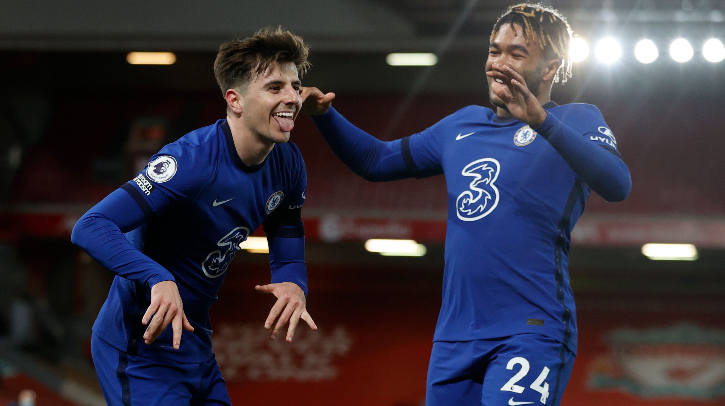 Chelsea's English midfielder Mason Mount (L) celebrates scoring the opening goal during the English Premier League football match between Liverpool and Chelsea at Anfield in Liverpool, north west England on March 4, 2021.