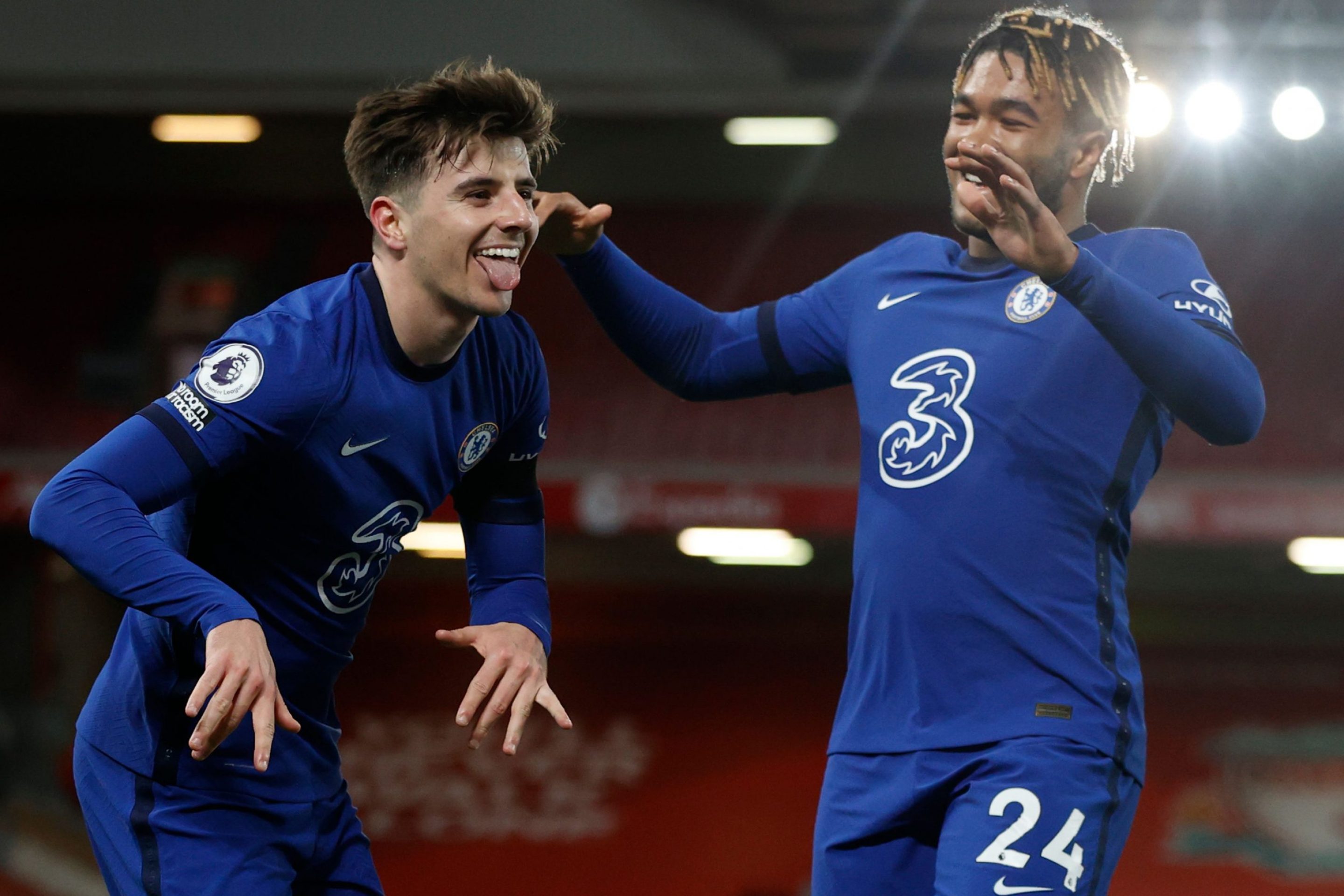 Chelsea's English midfielder Mason Mount (L) celebrates scoring the opening goal during the English Premier League football match between Liverpool and Chelsea at Anfield in Liverpool, north west England on March 4, 2021.