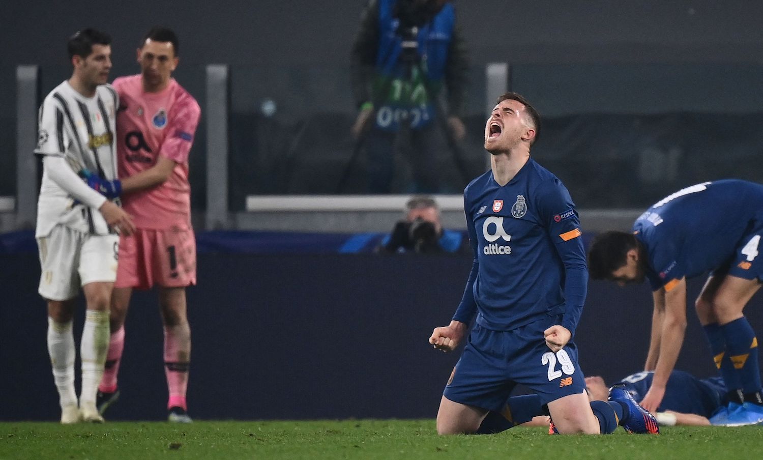 FC Porto's Spanish forward Toni Martinez (C-R) celebrates as FC Porto's Argentinian goalkeeper Agustin Marchesin (2ndL Rear) comforts Juventus' Spanish forward Alvaro Morata at the end of the UEFA Champions League round of 16 second leg football match between Juventus Turin and FC Porto on March 9, 2021 at the Juventus stadium in Turin. (Photo by Marco BERTORELLO / AFP) (Photo by MARCO BERTORELLO/AFP via Getty Images)