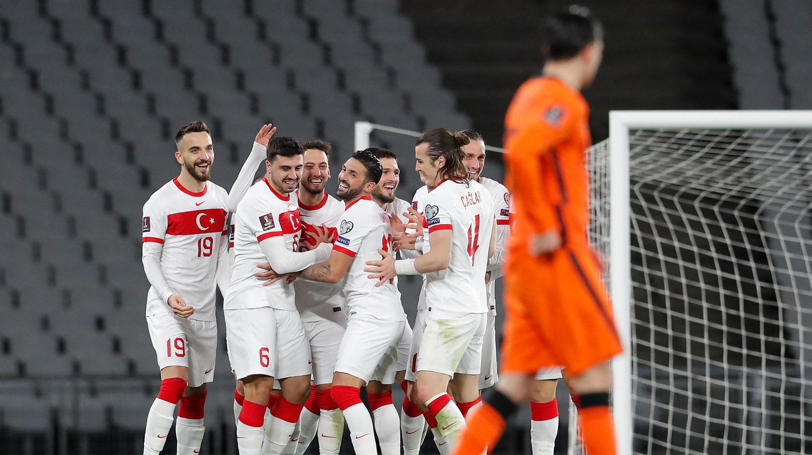Turkey's players celebrate after scoring their teams's third goal during the FIFA World Cup Qatar 2022 qualification Group G football match between Turkey and The Netherlands at the Ataturk Olympic Stadium, in Istanbul, on March 24, 2021.