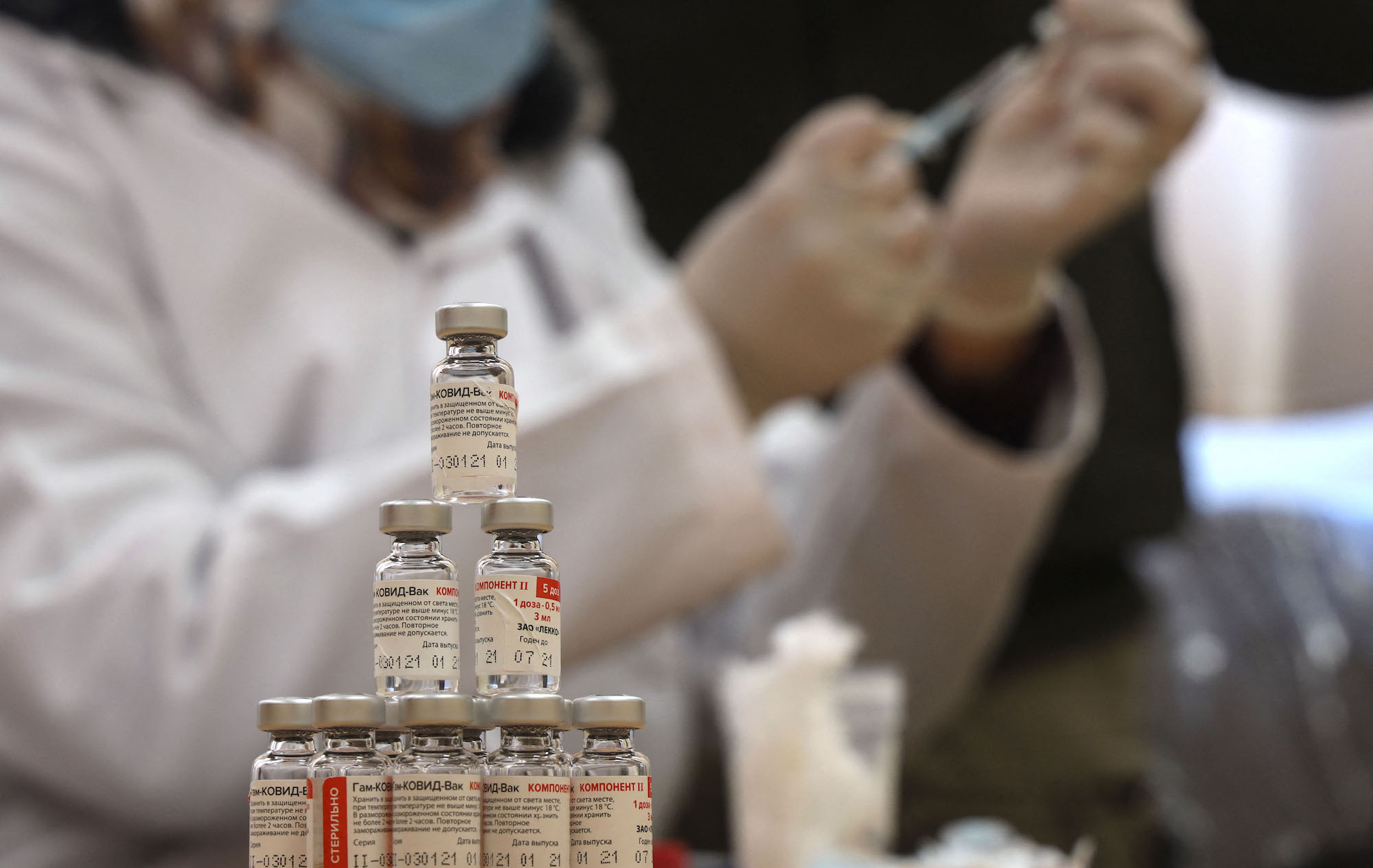 Vials of the Russian Sputnik V COVID-19 vaccine are pictured during vaccination in Gaza City on March 25, 2021. - Thousands of Palestinian health workers, the elderly, and patients with cancer or kidney disease were set to get Covid-19 vaccines as the health ministry ramped up its inoculation campaign (Photo by Mohammed ABED / AFP) (Photo by MOHAMMED ABED/AFP via Getty Images)