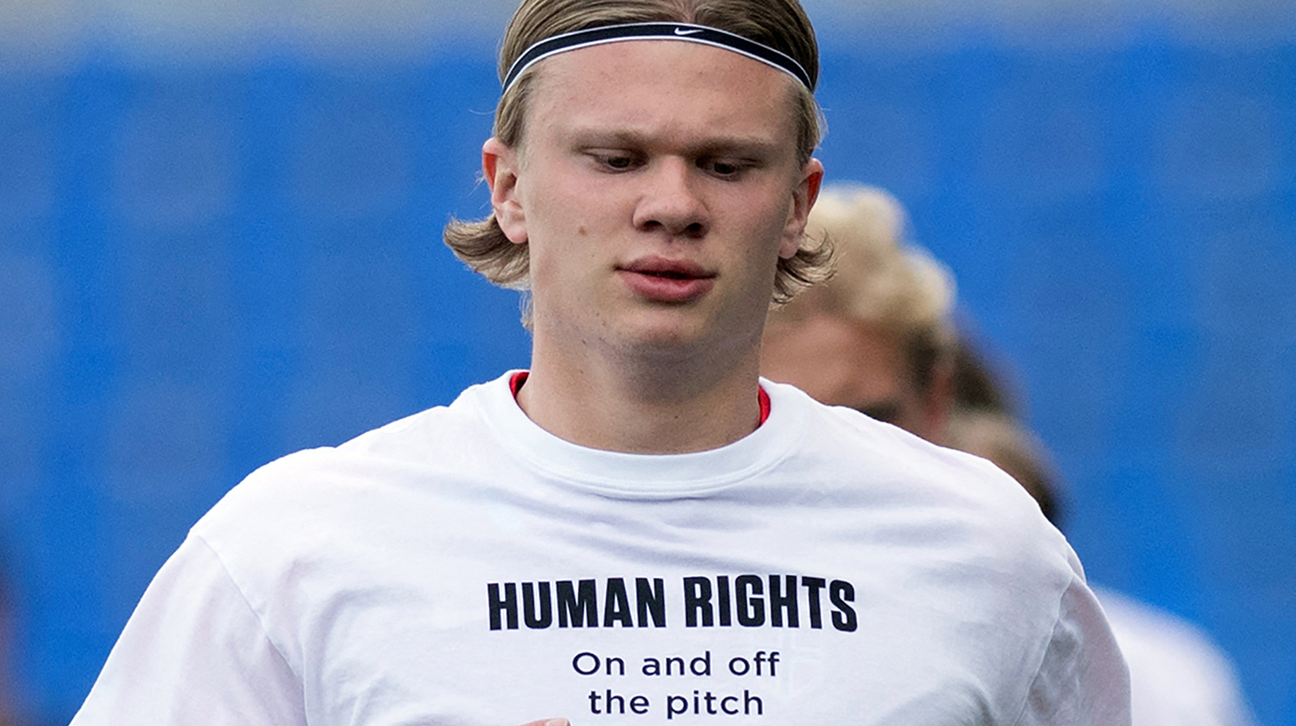 Norway's forward Erling Braut Haaland wears a t-shirt with the slogan 'Human rights, on and off the pitch' as he warms up before the FIFA World Cup Qatar 2022 qualification football match between Norway and Turkey at La Rosaleda stadium in Malaga on March 27, 2021