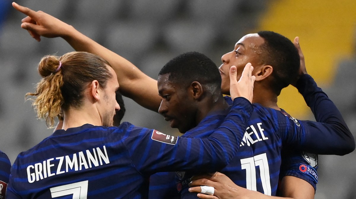 France's forward Ousmane Dembele (C) celebrates with France's forward Antoine Griezmann (L) and France's forward Anthony Martial (R) teammates after scoring a goal during the FIFA World Cup Qatar 2022 qualification Group D football match between Kazakhstan and France, at the Astana Arena, in Nur-Sultan, on March 28, 2021.